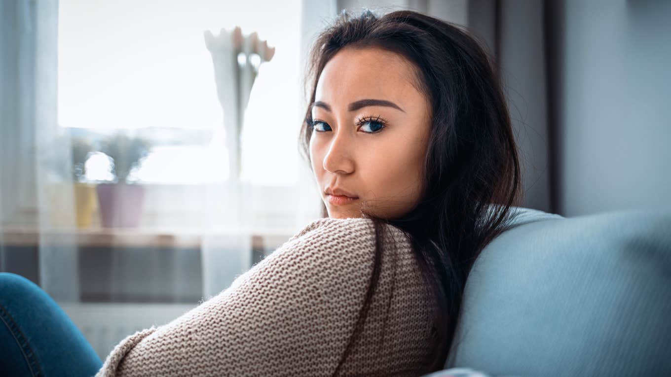 Small Signs Of A Woman Who Is Deeply Unhappy With Her Life unhappy woman glaring sadly