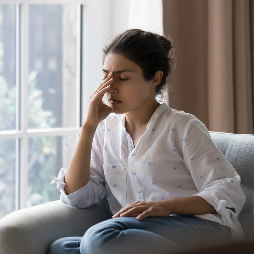 upset woman listening to lies her brain tells her