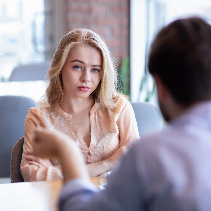 woman looking at man who's using her as human ego booster