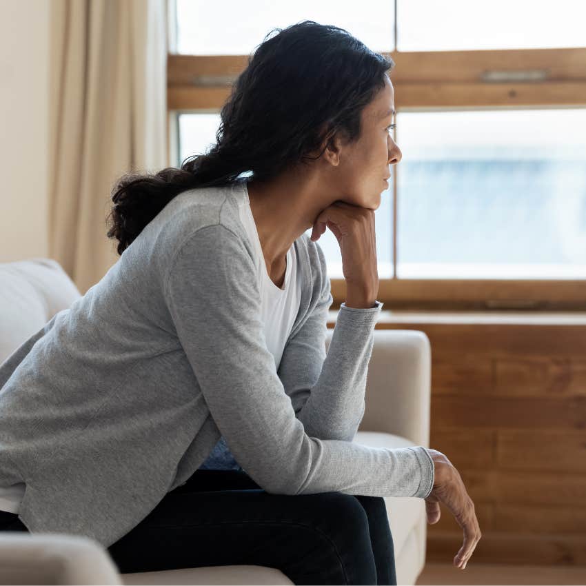 upset alone woman who is fragile and guarded about people
