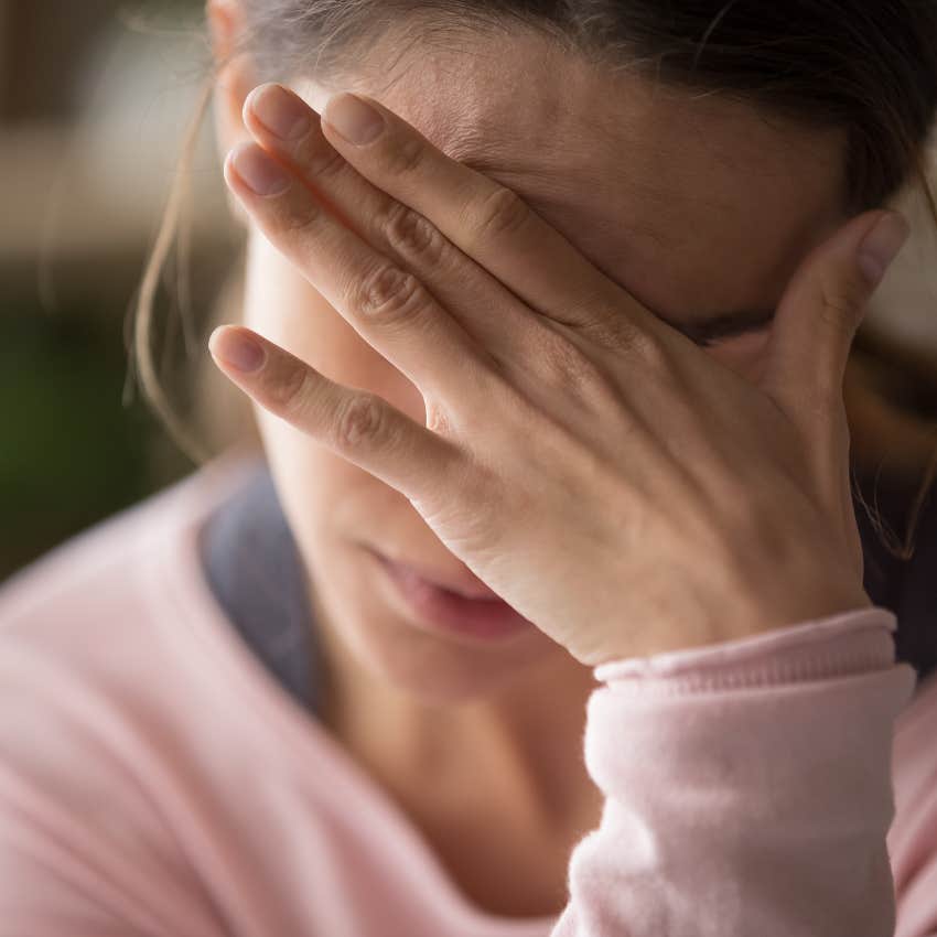 upset woman being warned from universe about someone who's bad news