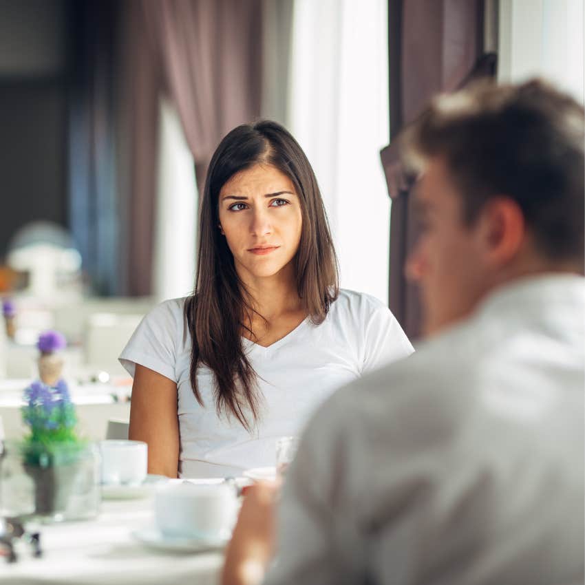 woman on bad date listening to man reveal his true intentions
