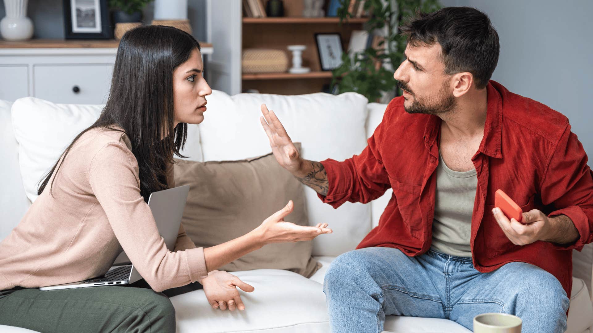 couple arguing on couch is a huge red flag