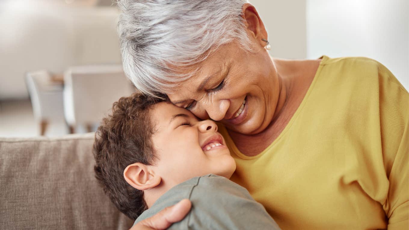 Things A Truly Loving Grandparent Will Always Do For Their Grandchild loving grandmother smiling and hugging her grandson