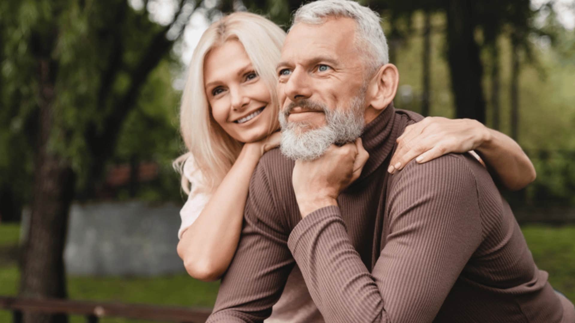boomer couple looking happy