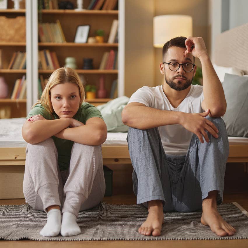 upset couple on ground knowing marriage is ending