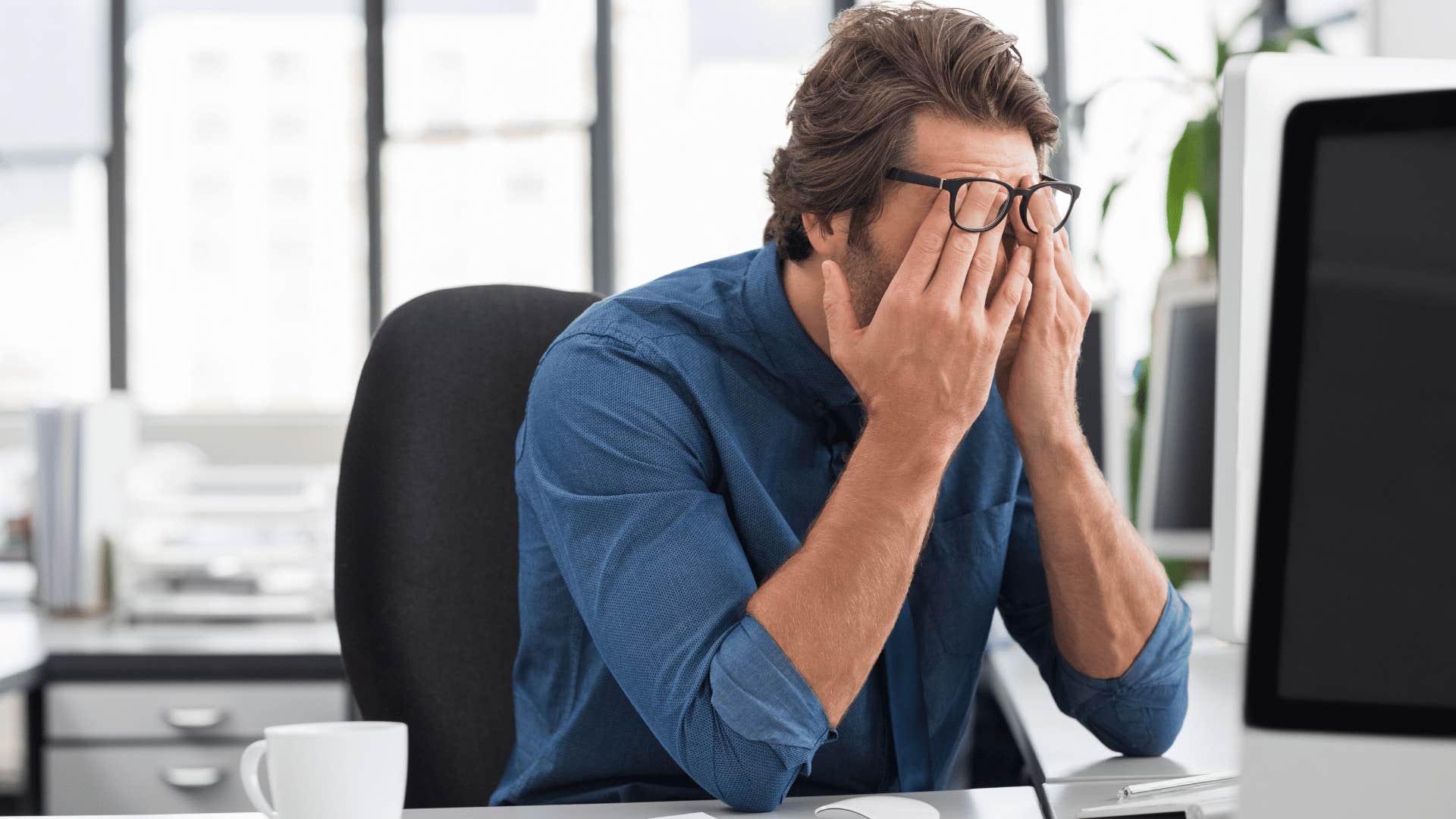 Gen X man doing hard work even though he doesn't enjoy it