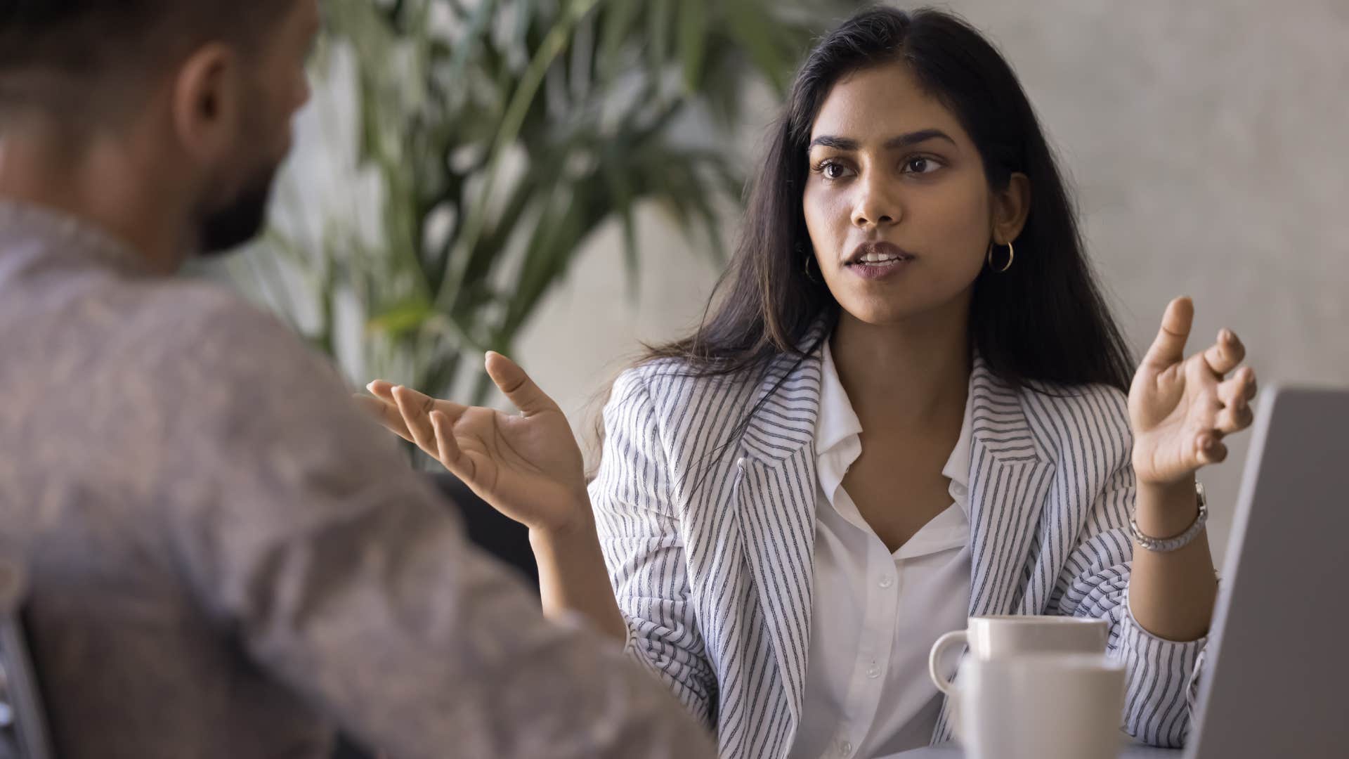 Gen Z woman having a serious conversation with peer
