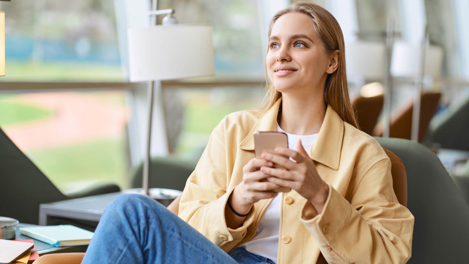 trendy Gen Z woman smiling in casual work attire