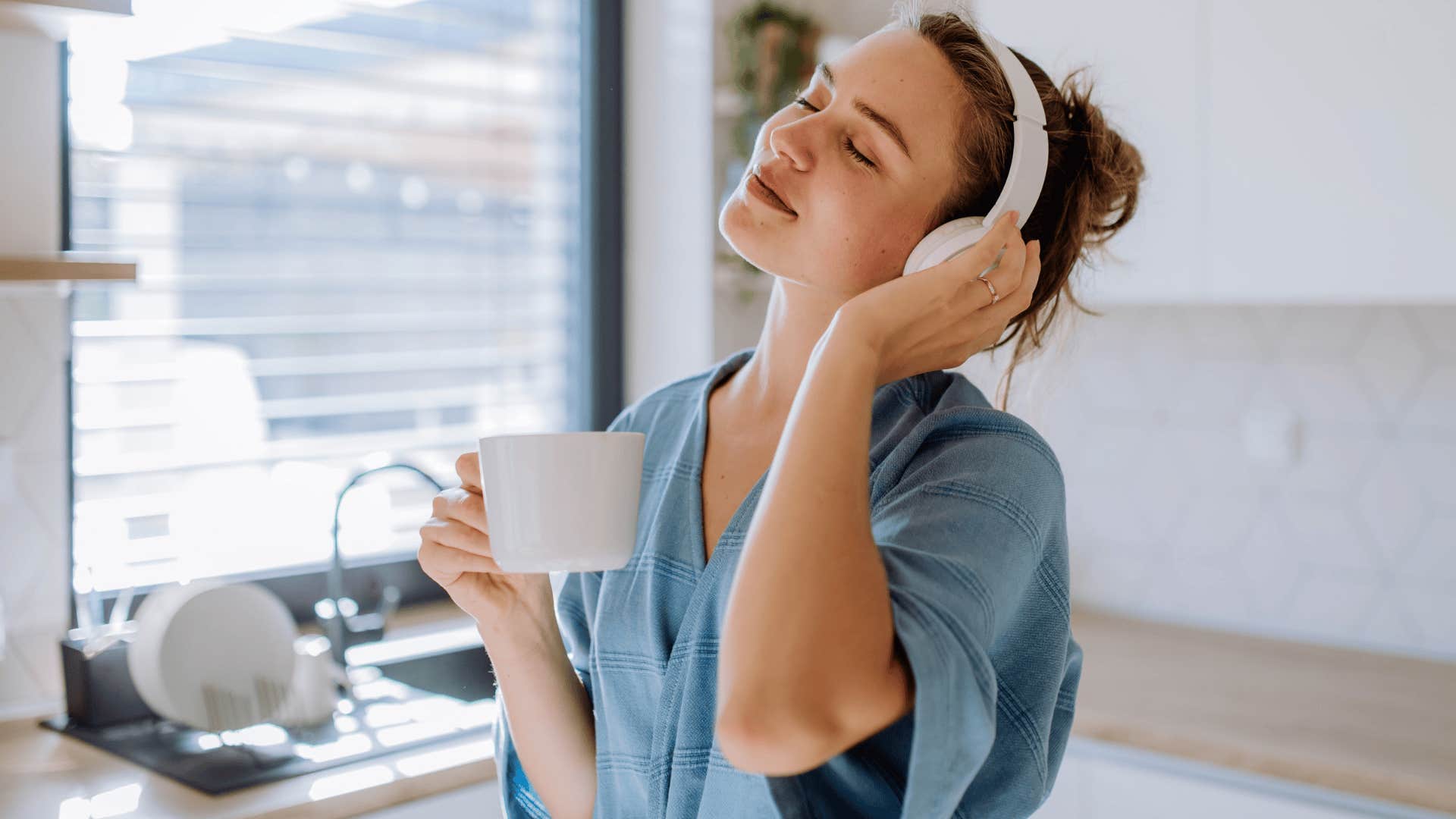 Gen Z woman smiling listening to music