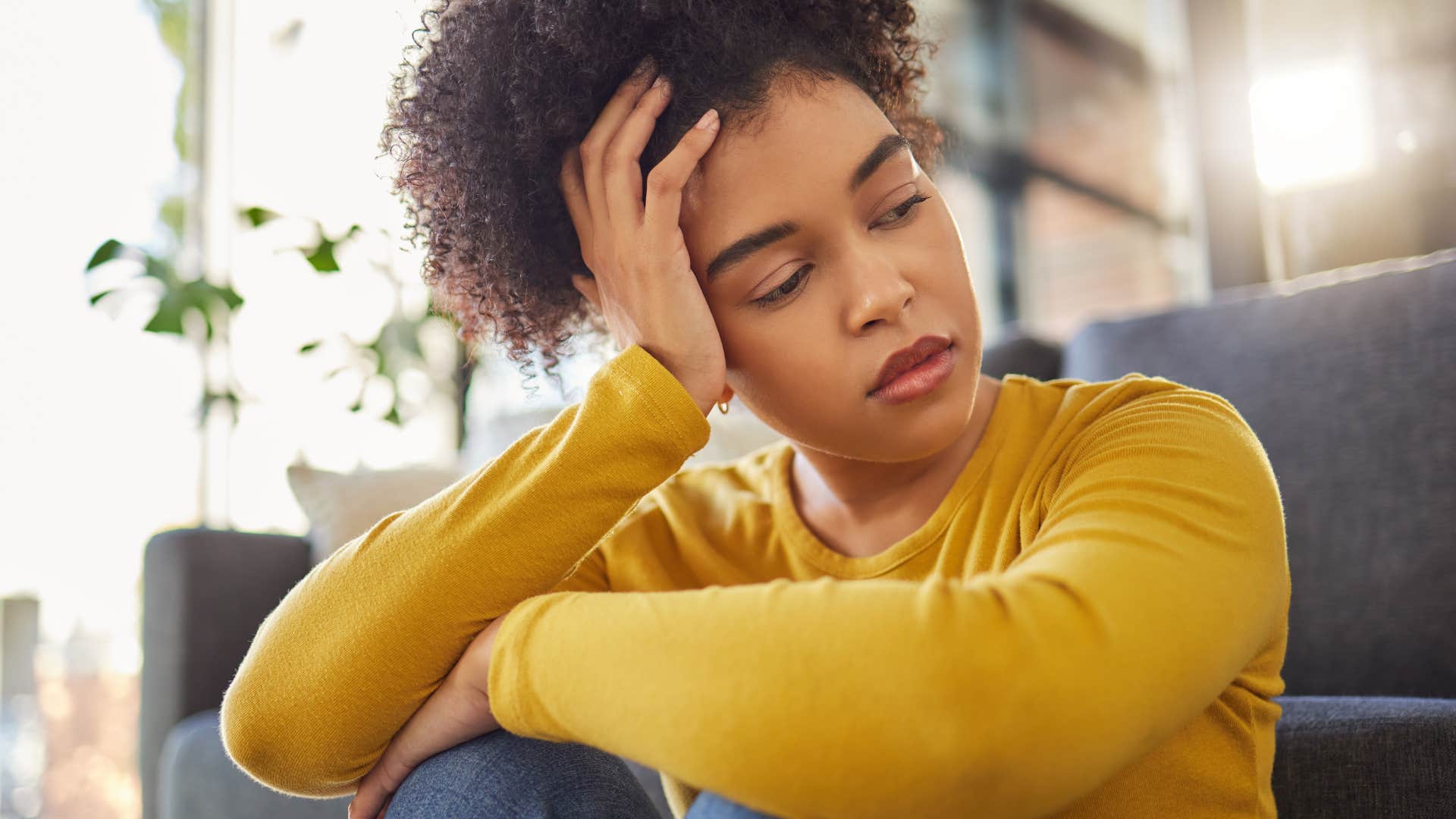 sad Gen Z woman looking stressed out