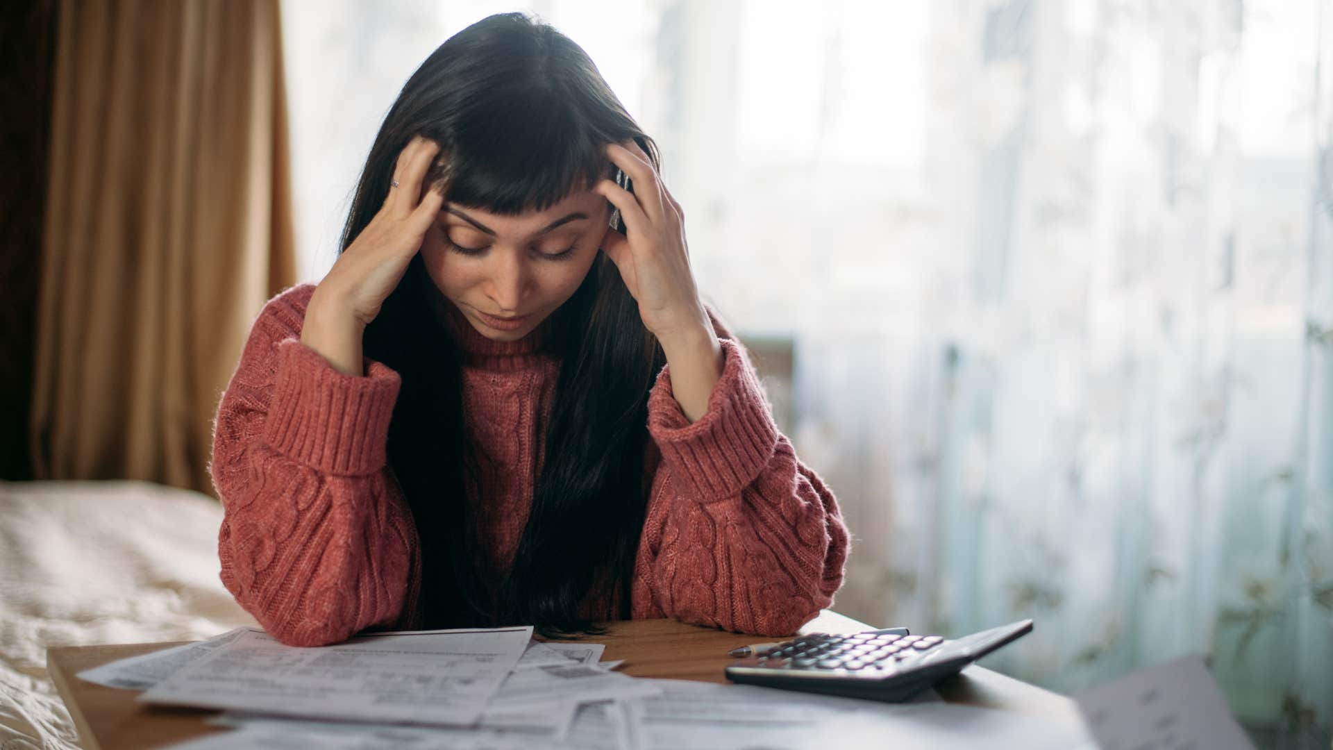 stressed Gen Z woman overwhelmed by bills
