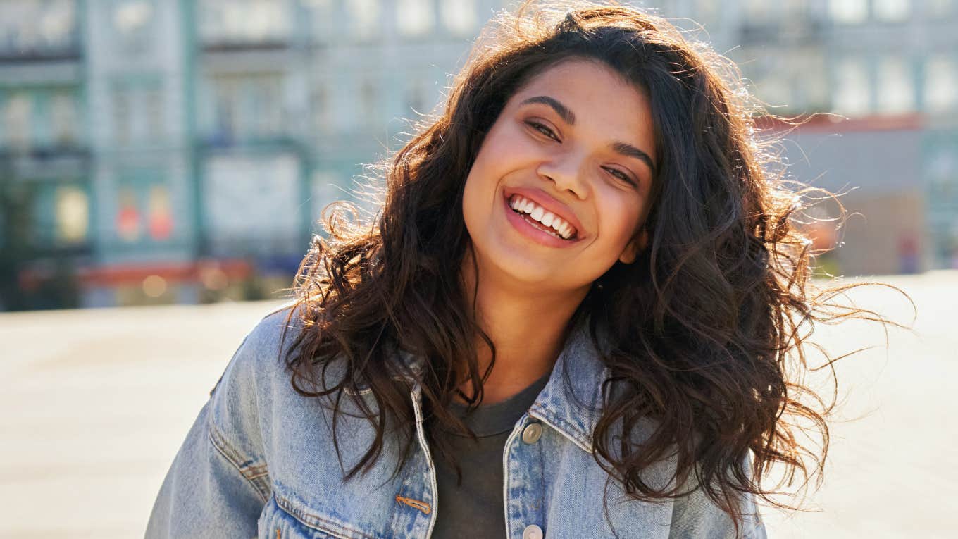 Things Gen Z Thinks Will Make Them Happy But Actually Won't gen z girl smiling outside