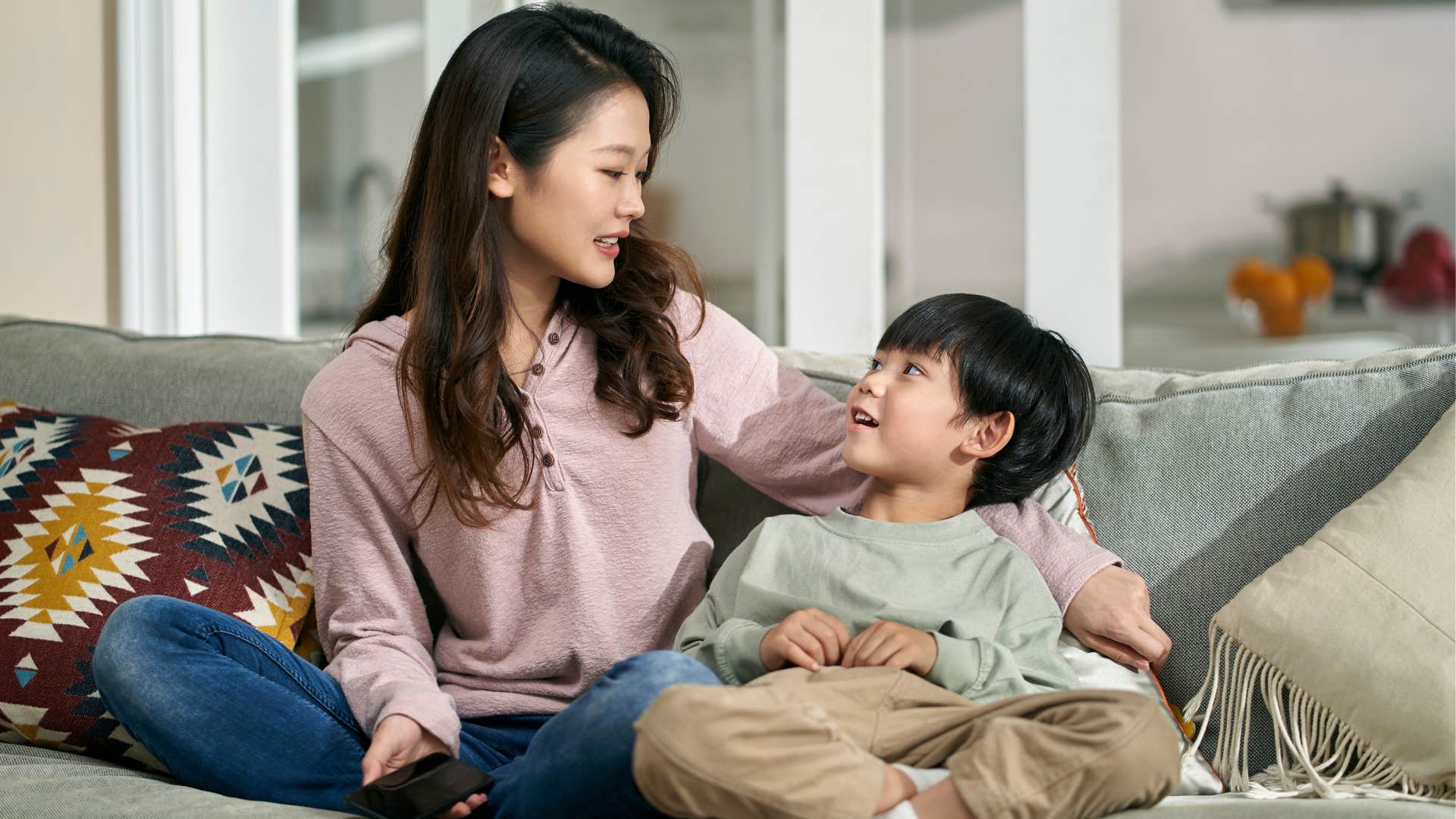 A mom compromises with her son over watching television.
