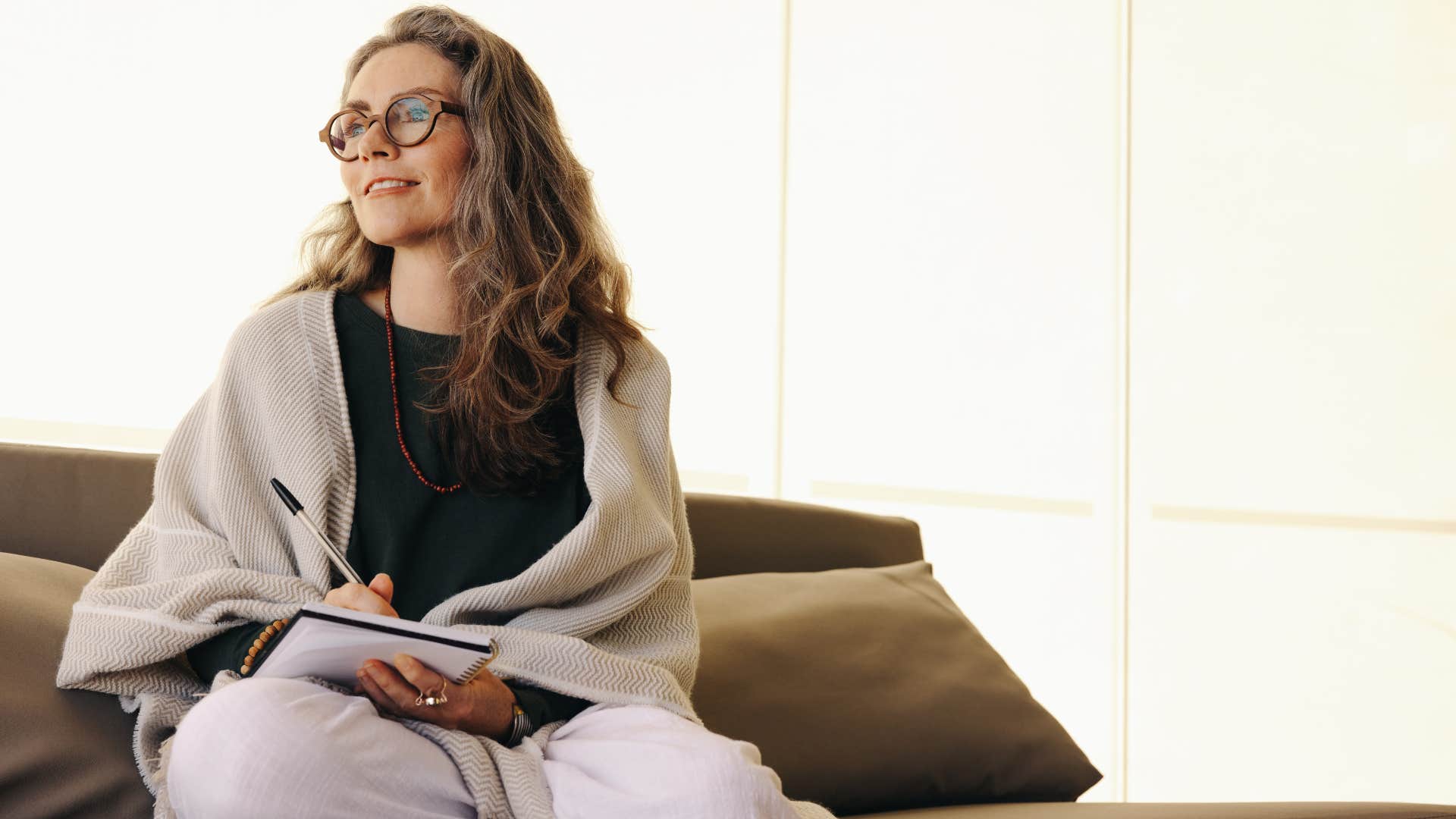 woman writing down affirmations