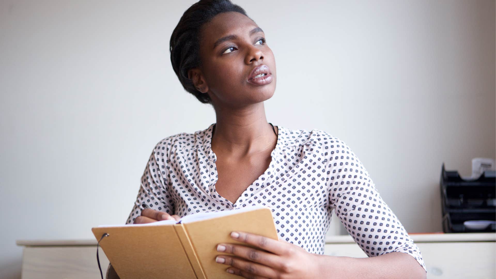 anxious woman writing in journal