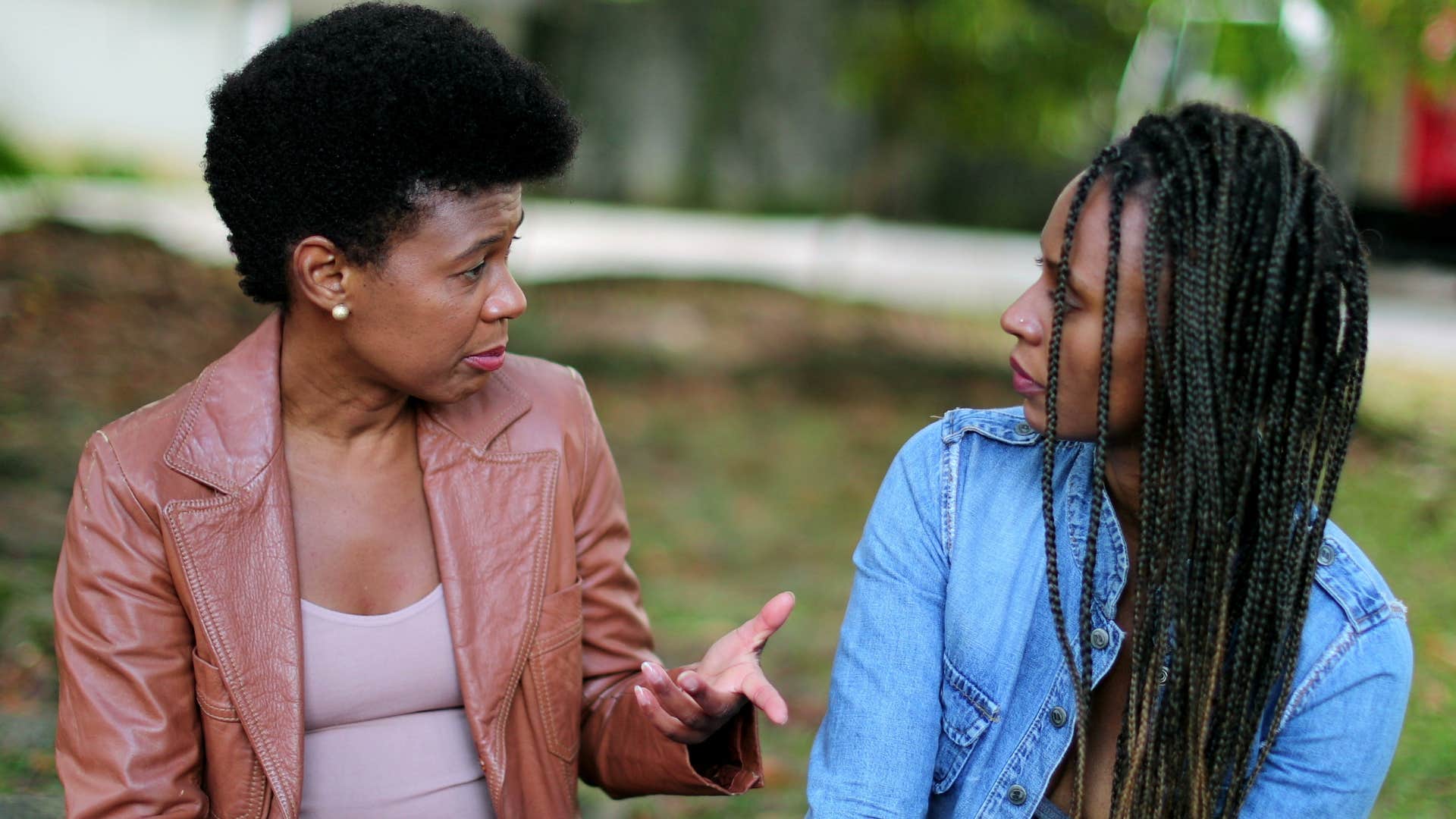 two women having a serious conversation