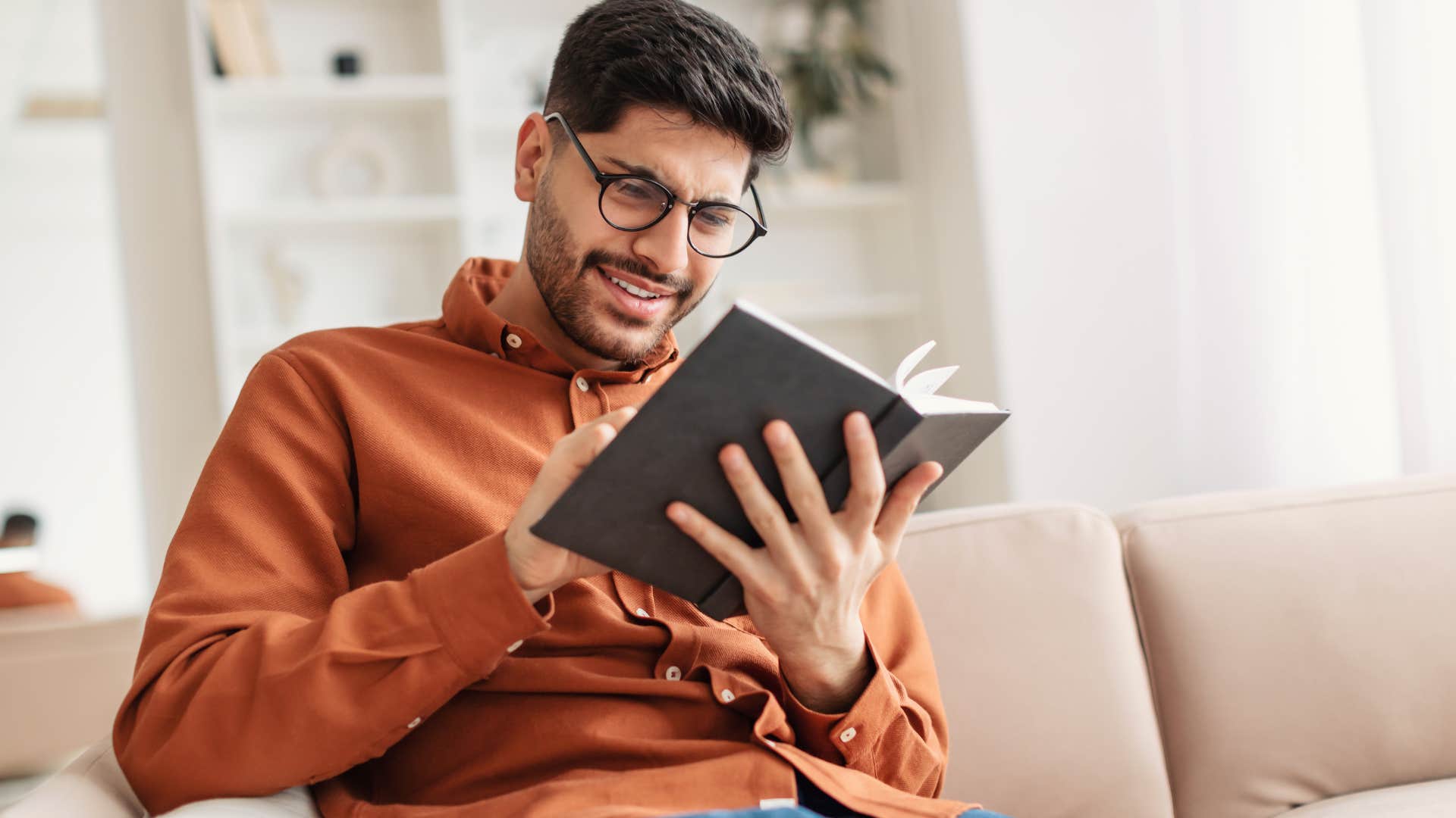 curious man reading a book
