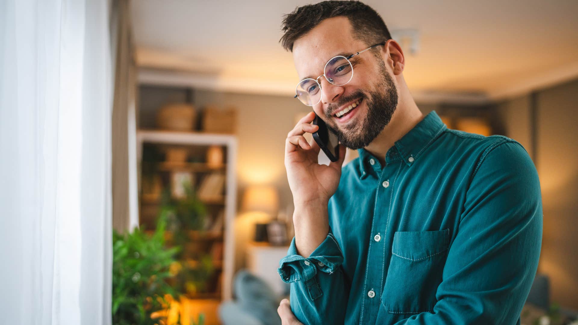 optimistic man talking on the phone