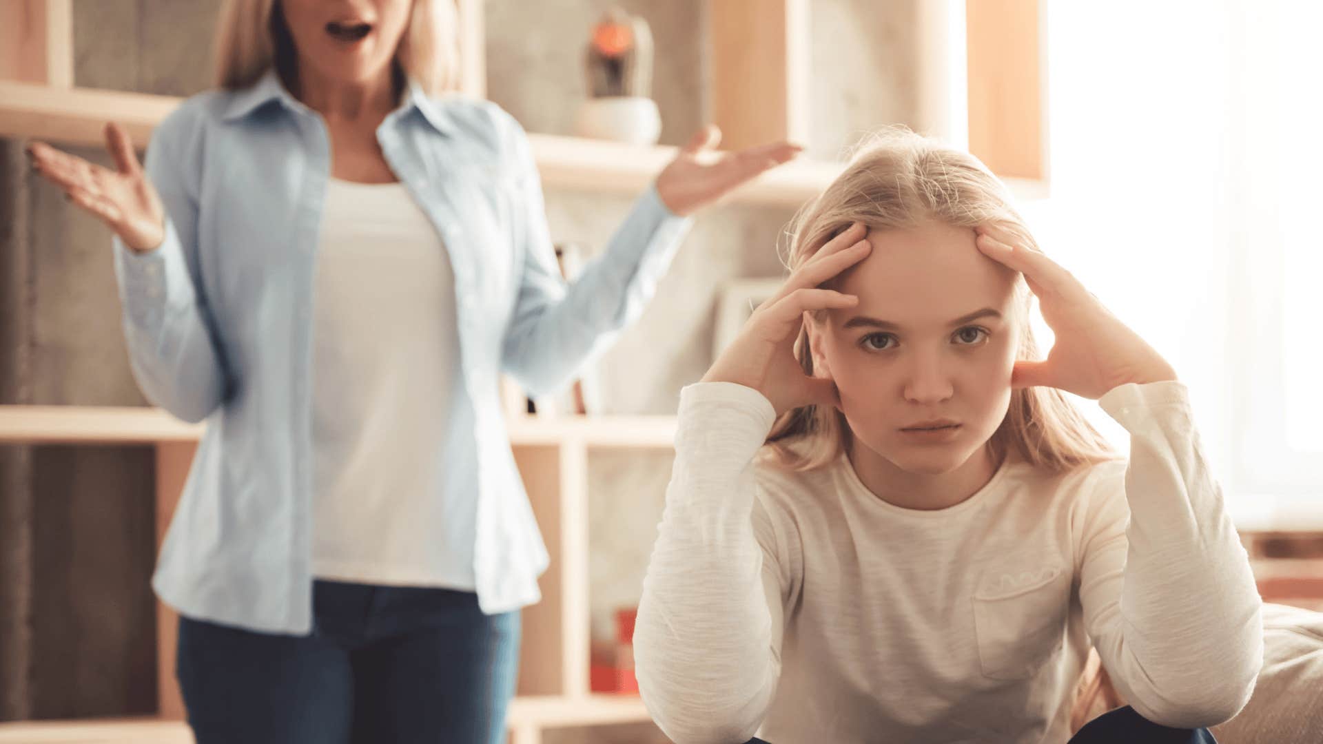 mother putting intense pressure on frustrated young daughter