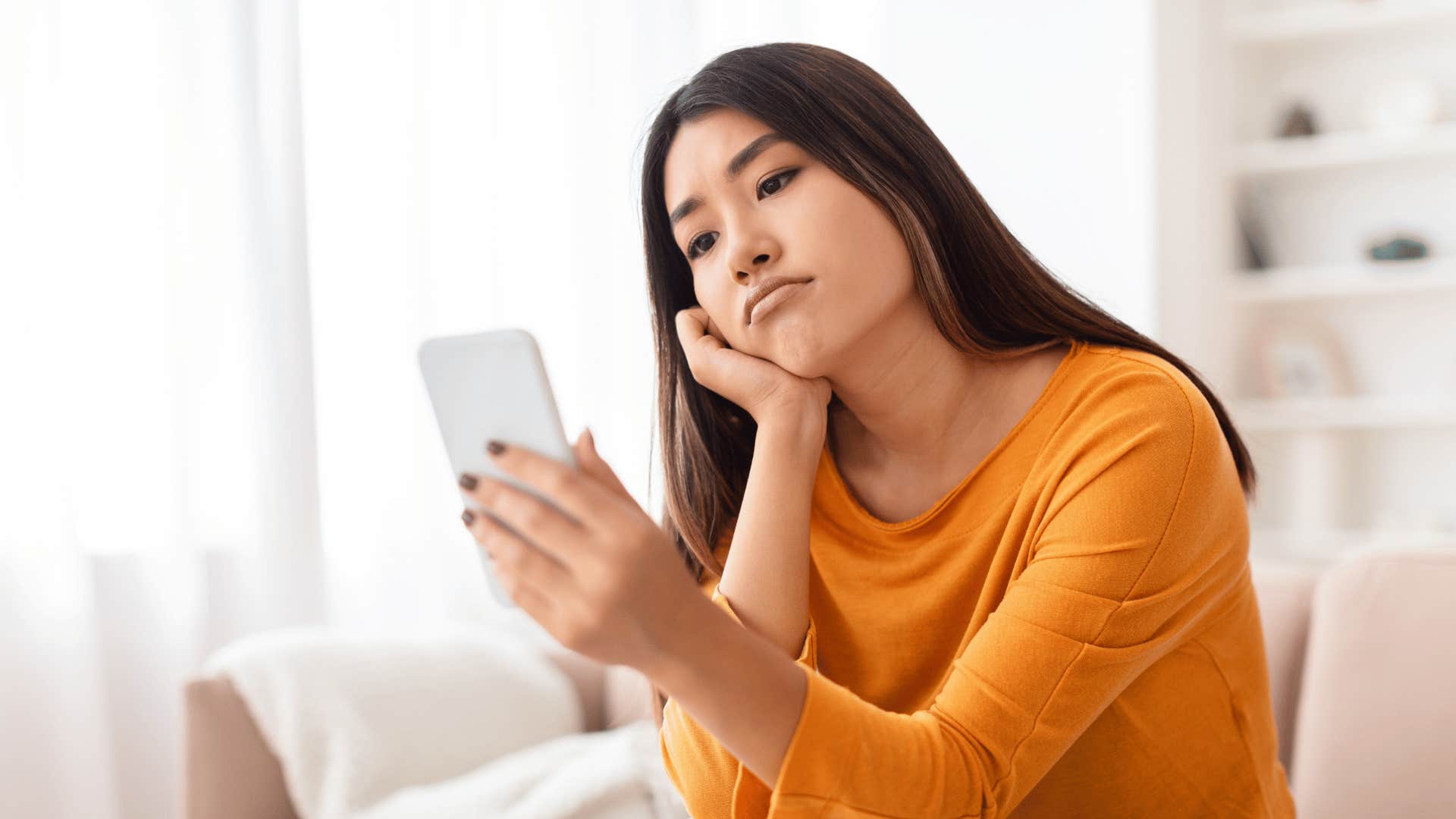 woman scrolling instagram on her phone