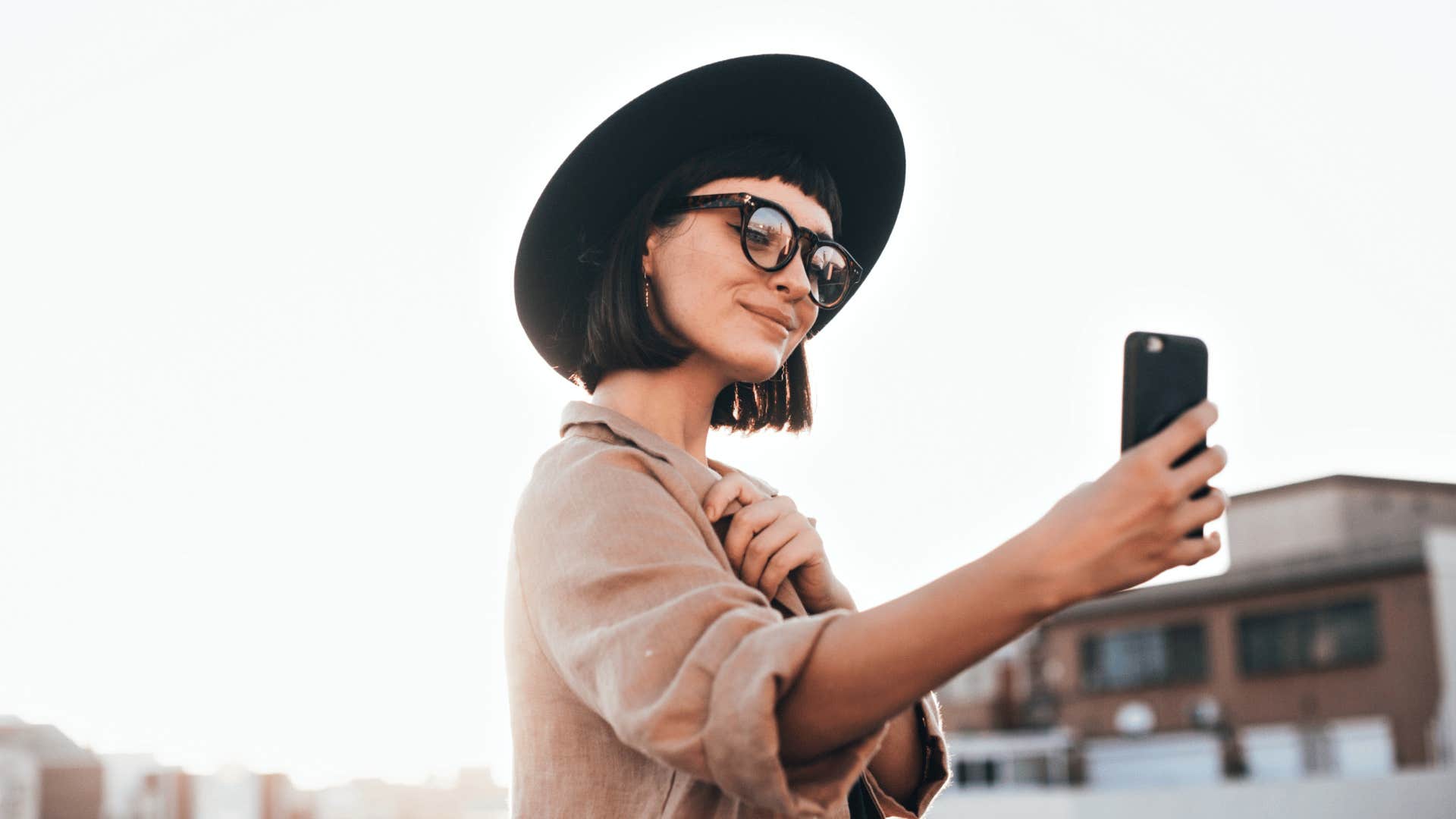 trendy millennial woman taking selfies