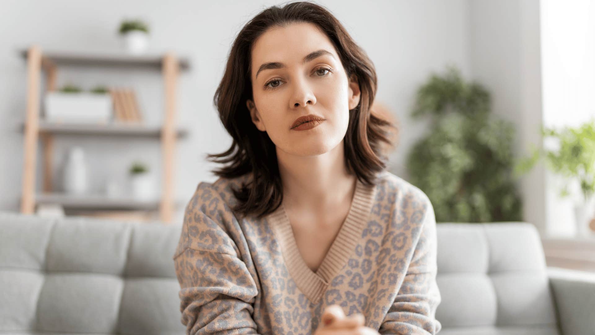 stressed millennial woman thinking about perfectionist tendencies