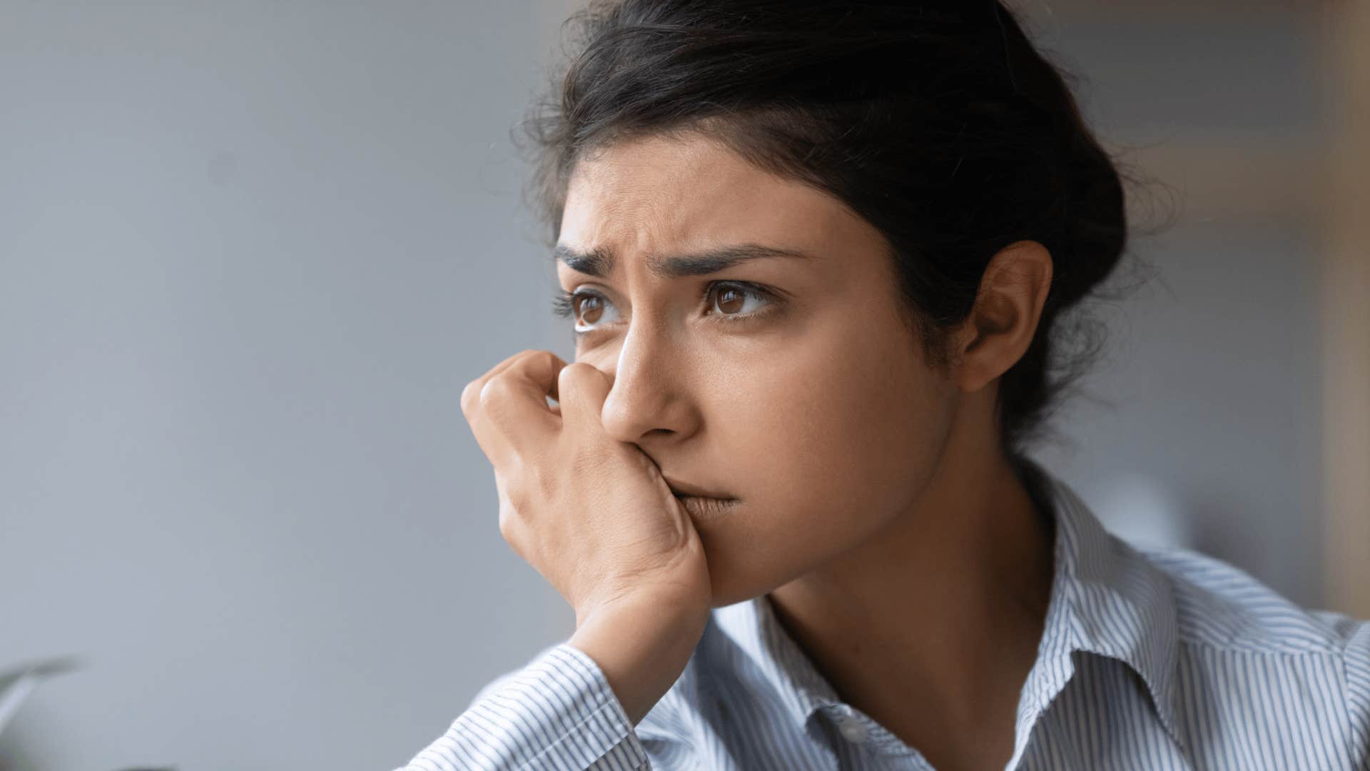 millennial woman thinking about her mistakes