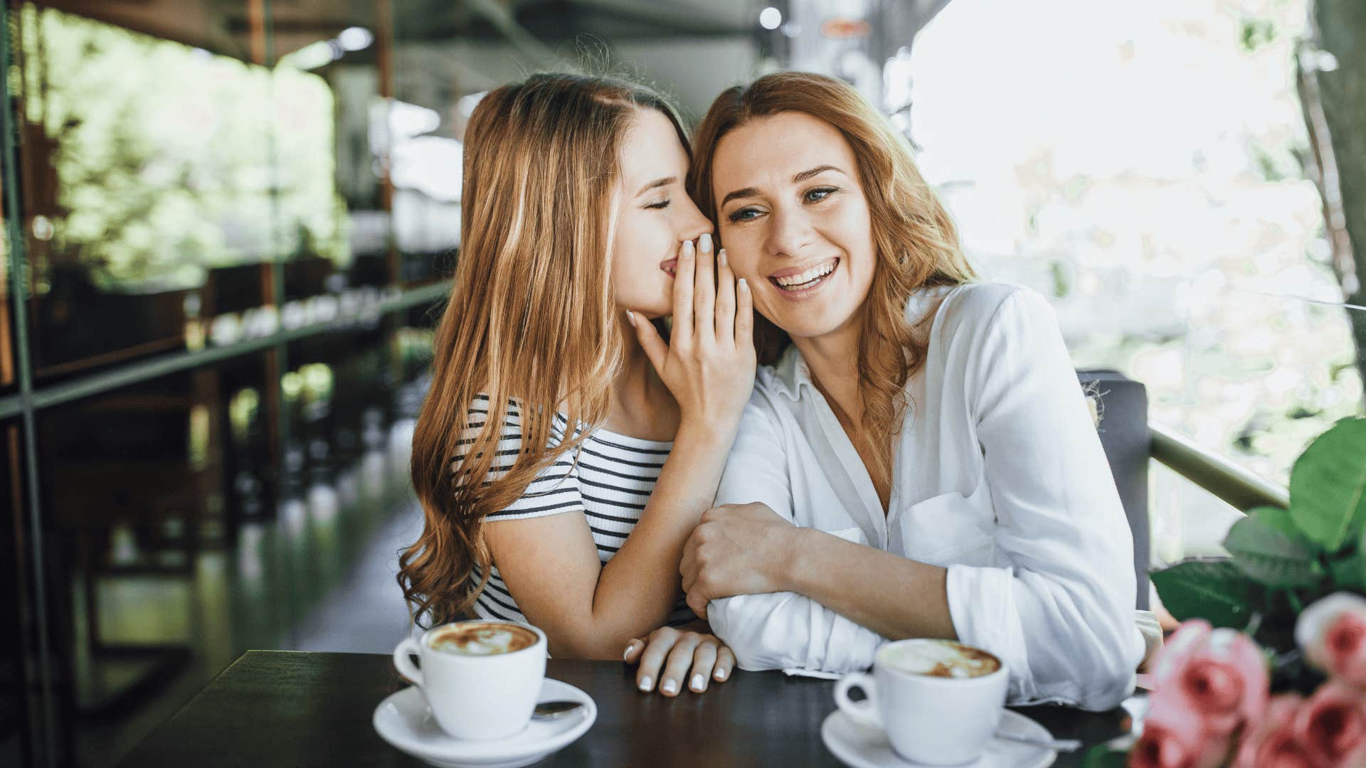 mother having coffee with her daughter taught her adulthood means no more homework