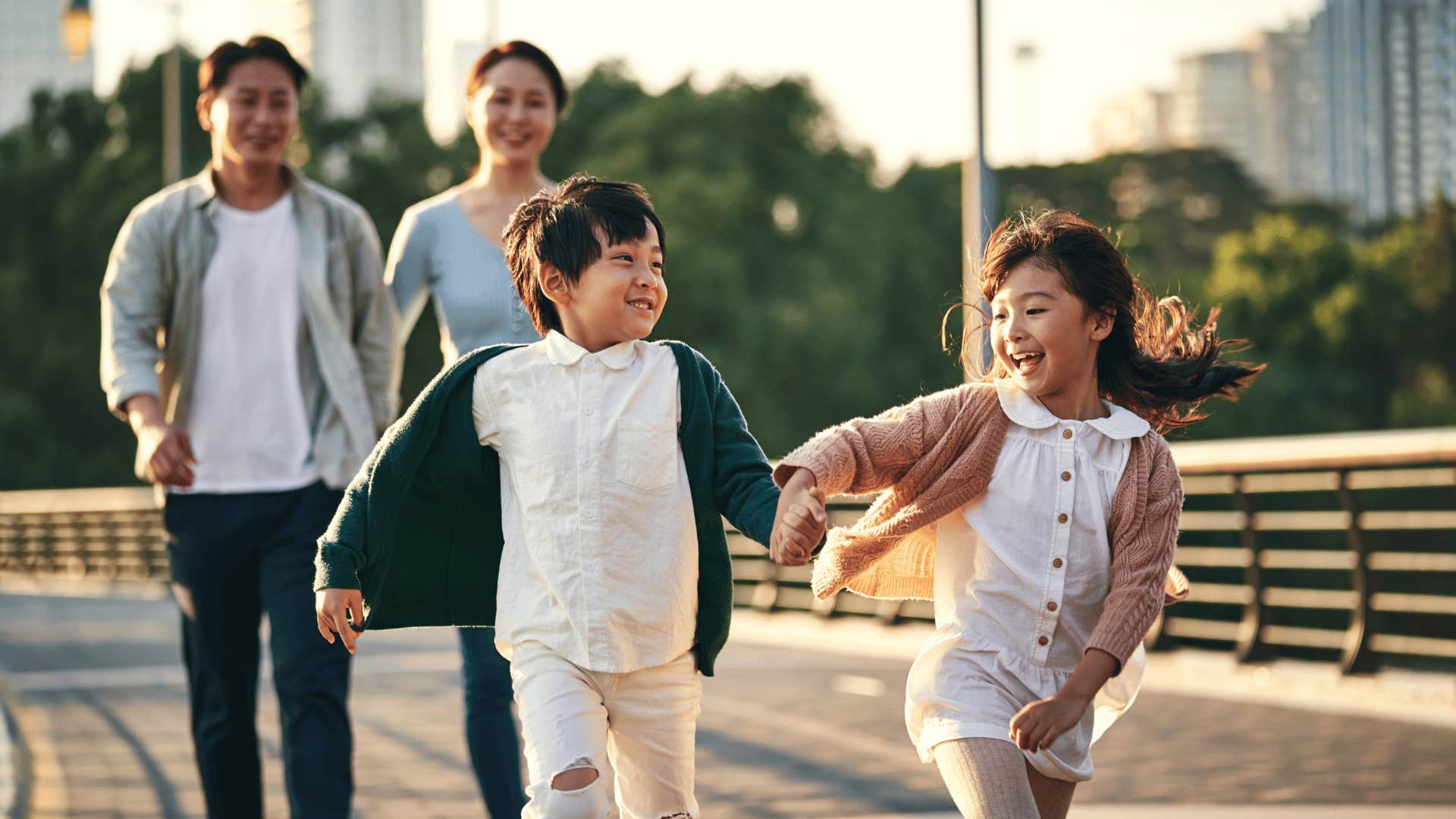 family watching two children play