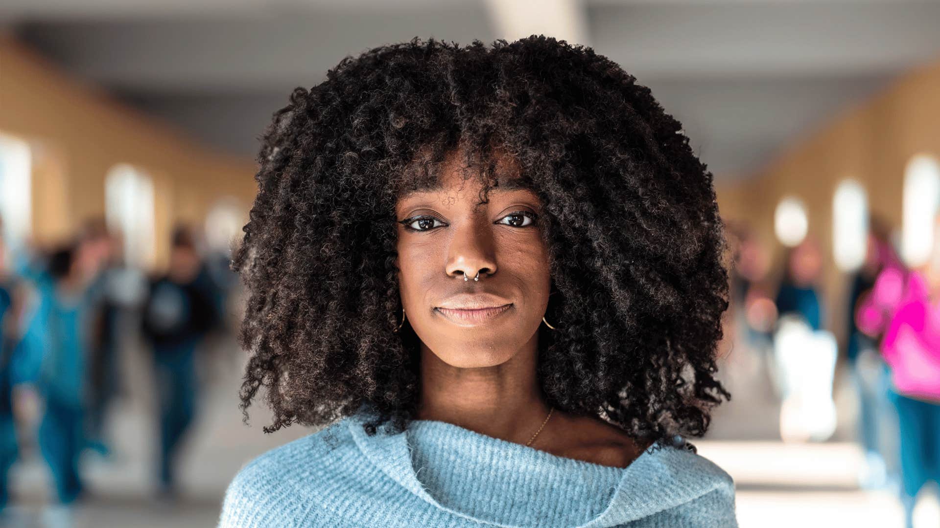 young woman in the halls of a school