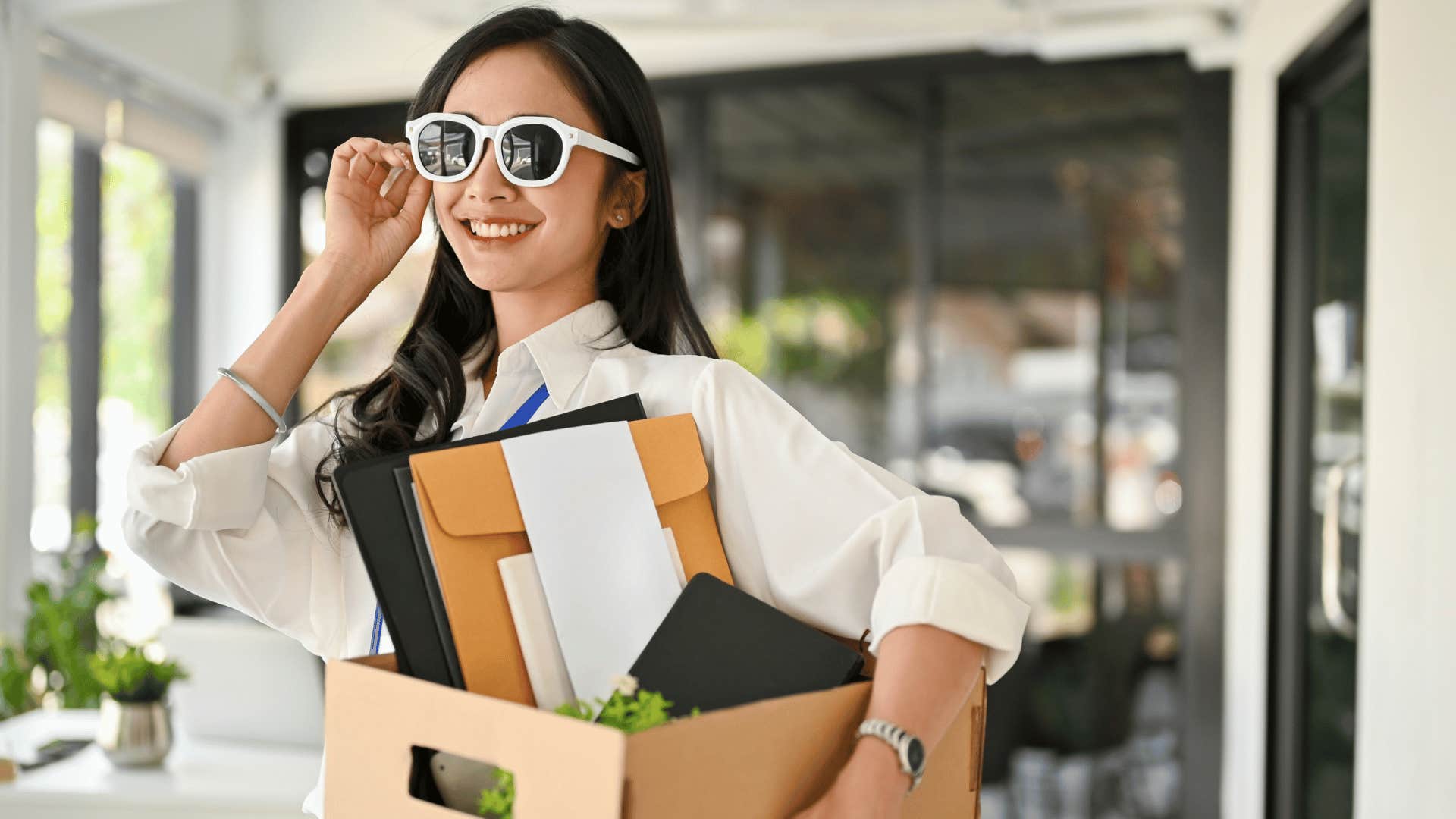 happy young woman leaving her job after quitting
