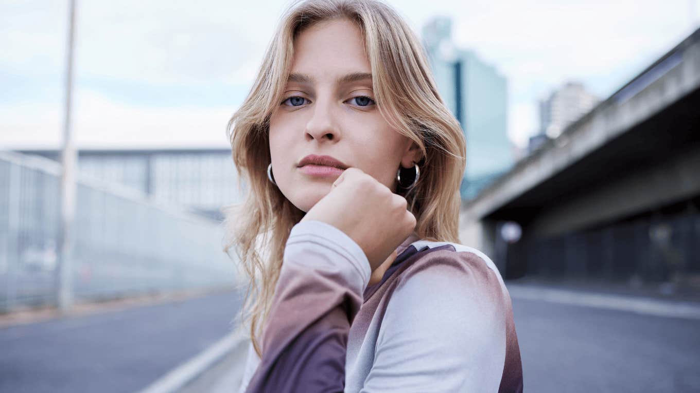 serious Gen Z woman staring ahead