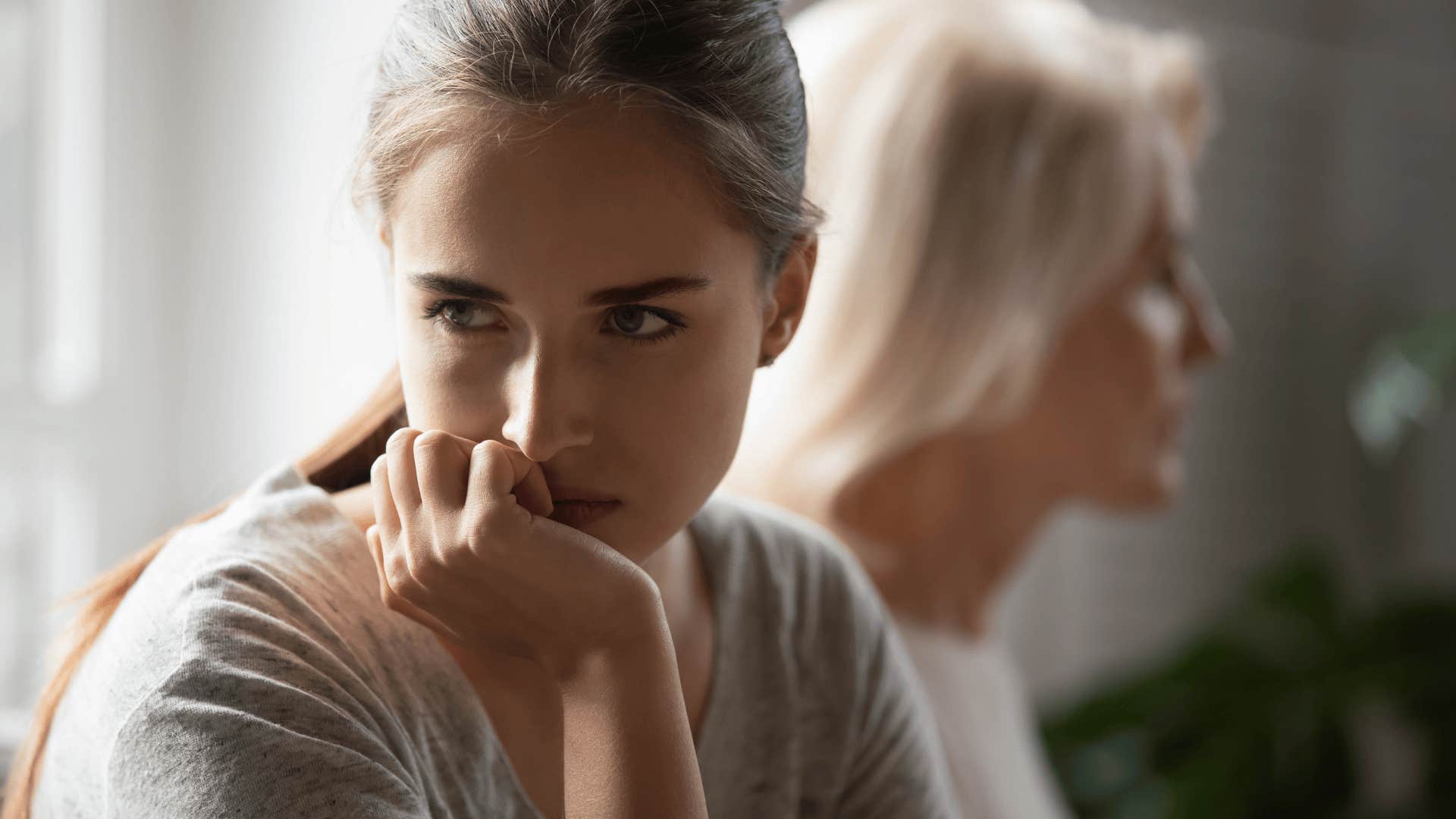upset woman looking away from her mother