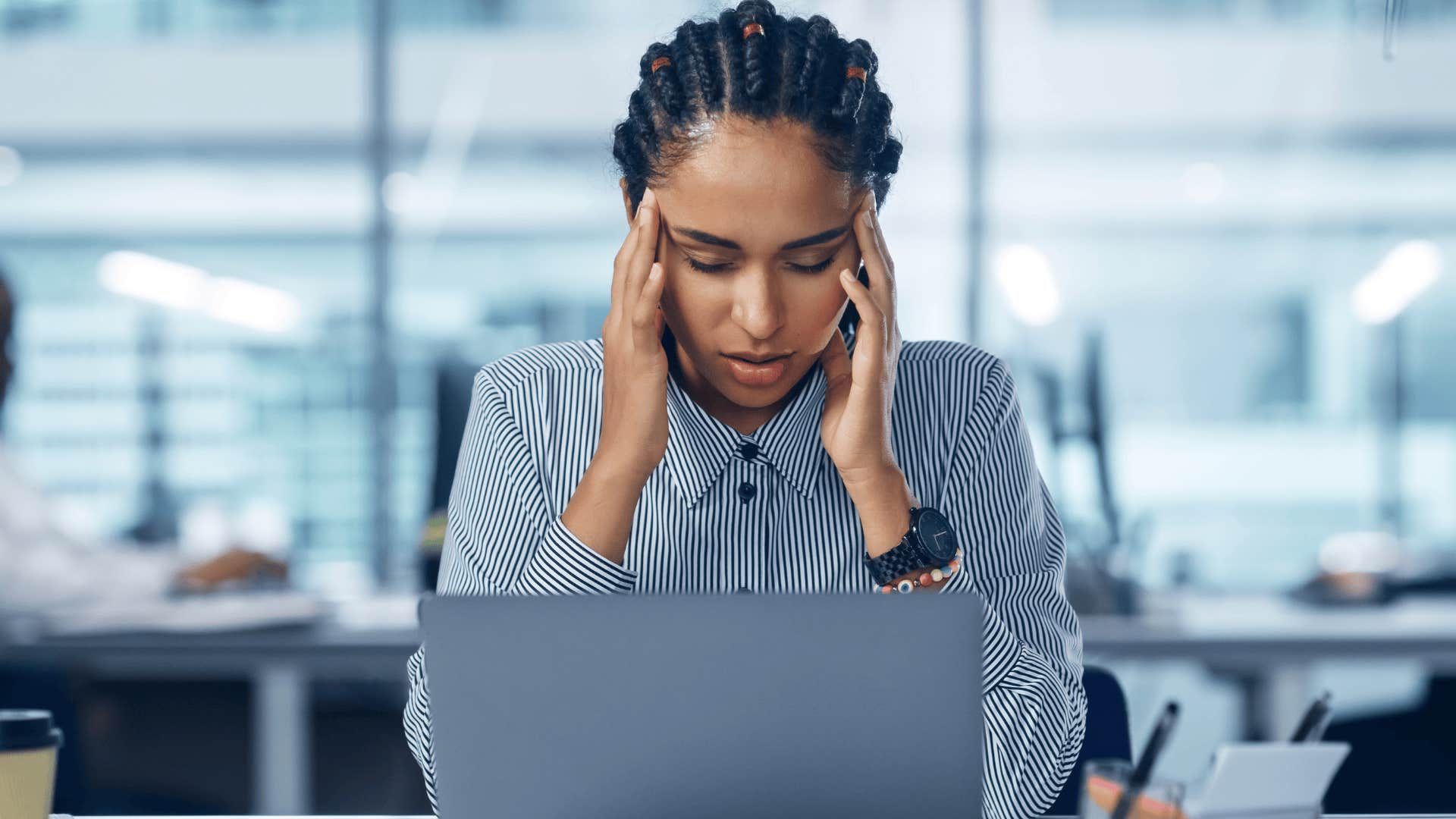 stressed woman working hard at her computer