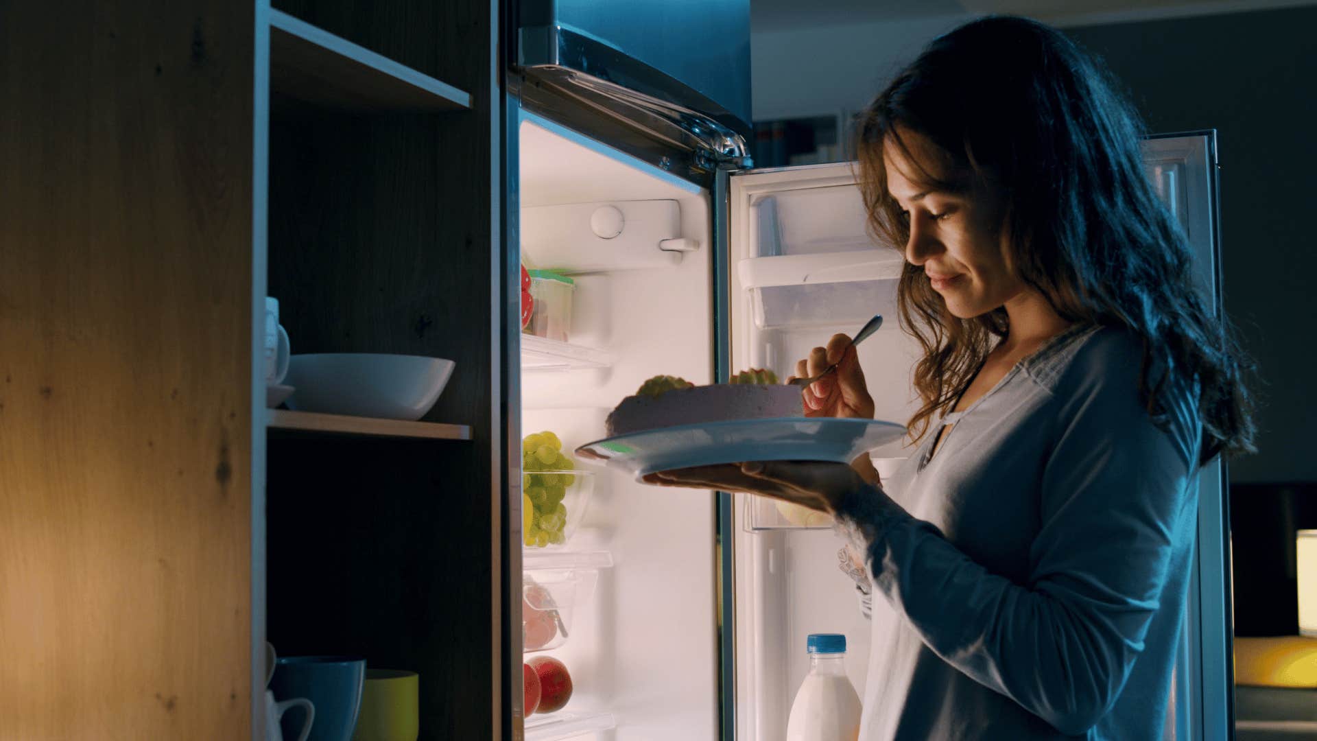woman eating unhealthy food because she's hungry