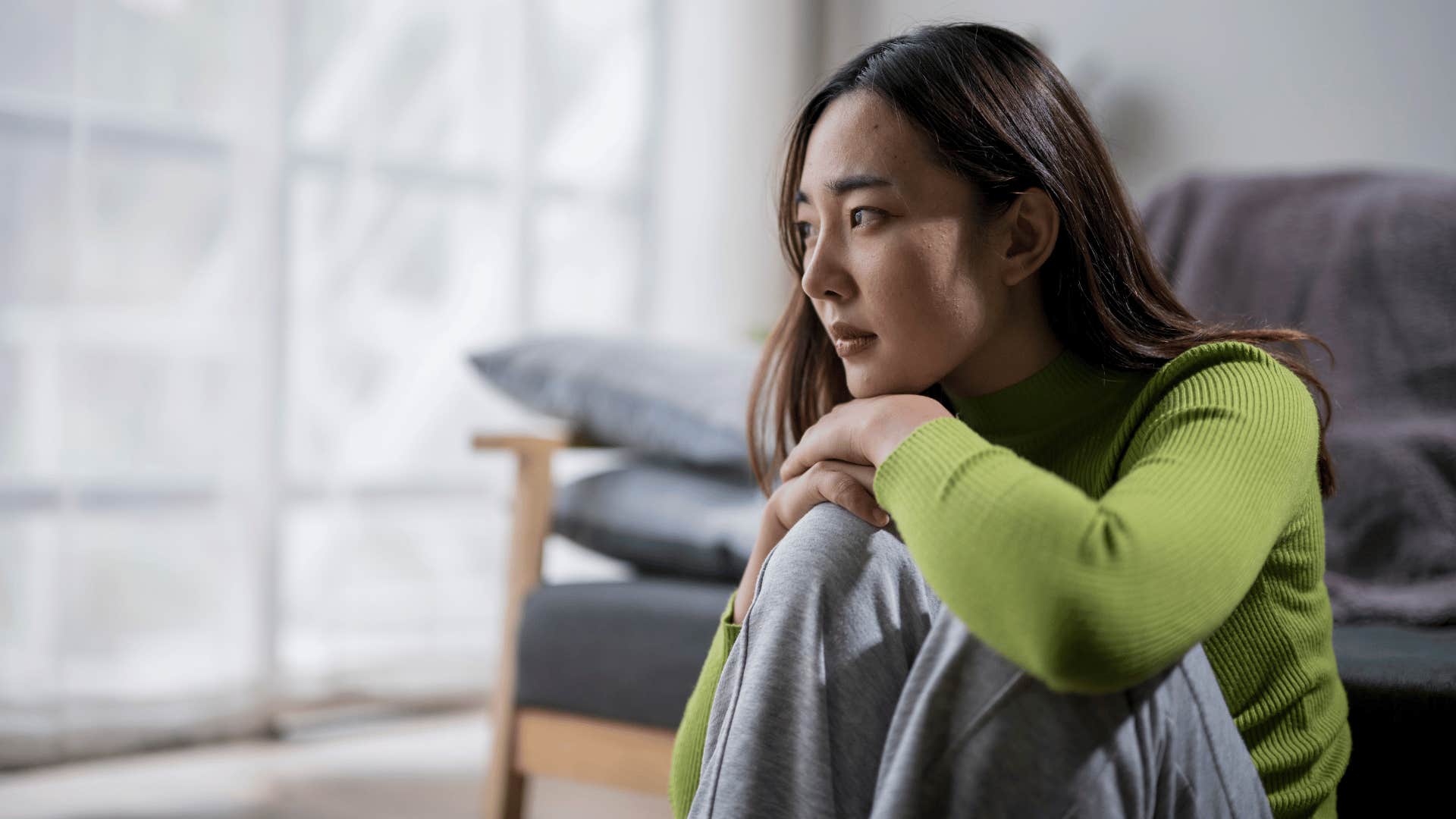 woman withdrawing socially because she's hungry