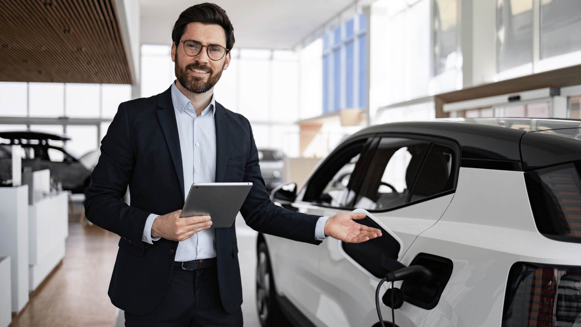 man showing an electric car