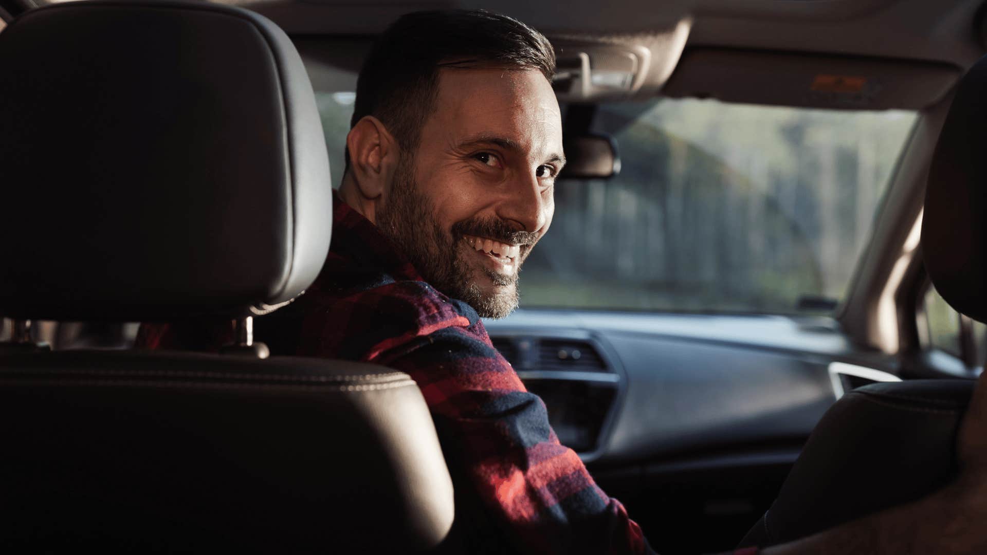 happy man driving a car