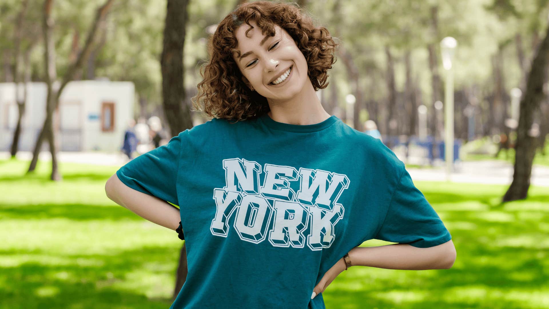 young woman smiling in a baggy t-shirt