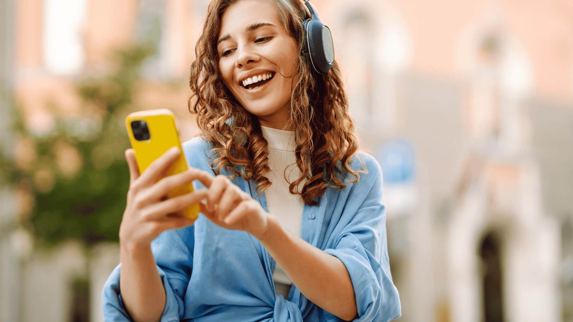 happy millennial woman listening to music