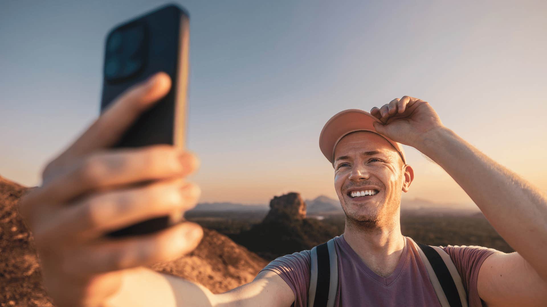 man taking a selfie on a hike