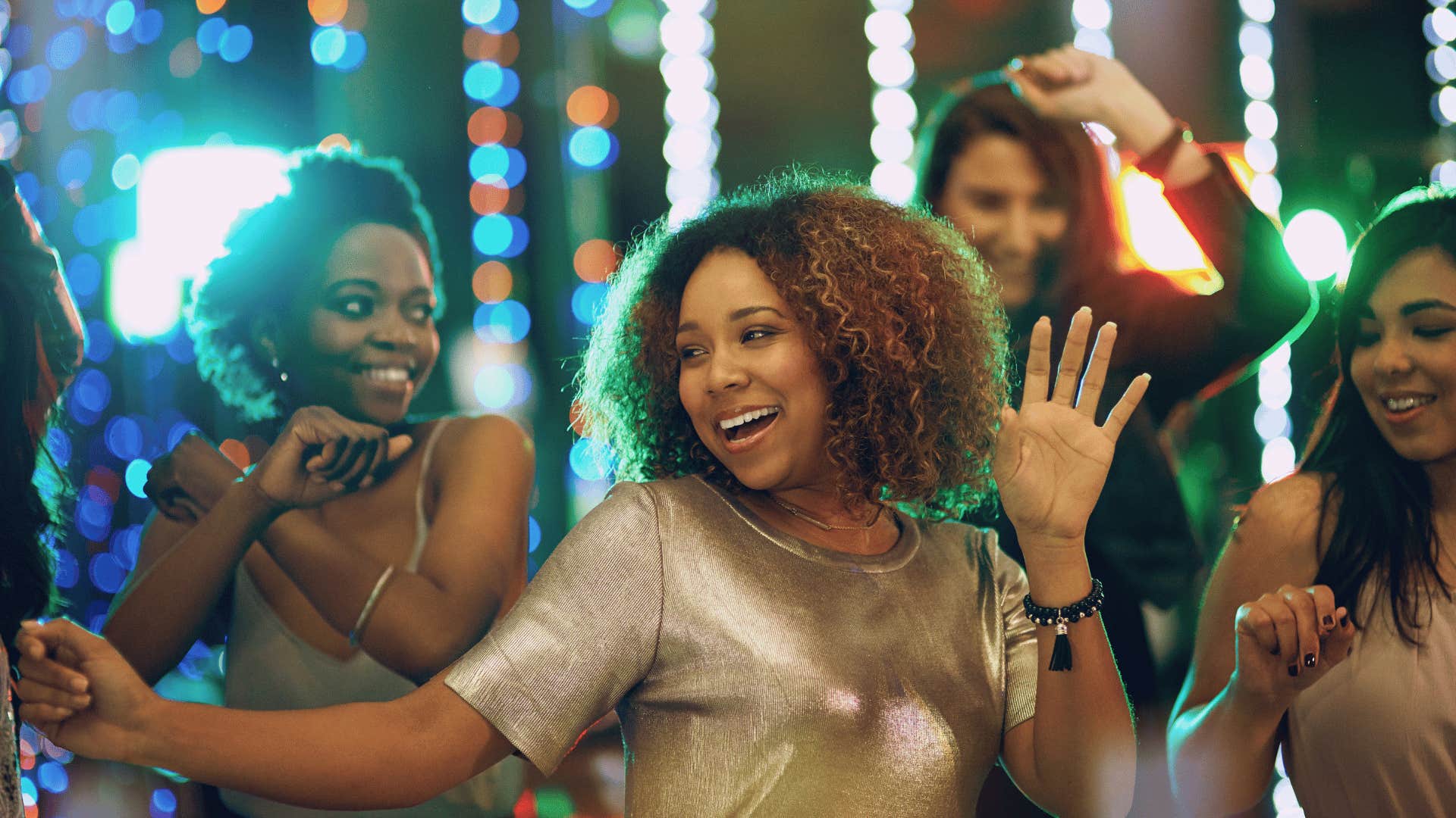 group of friends dancing at a club
