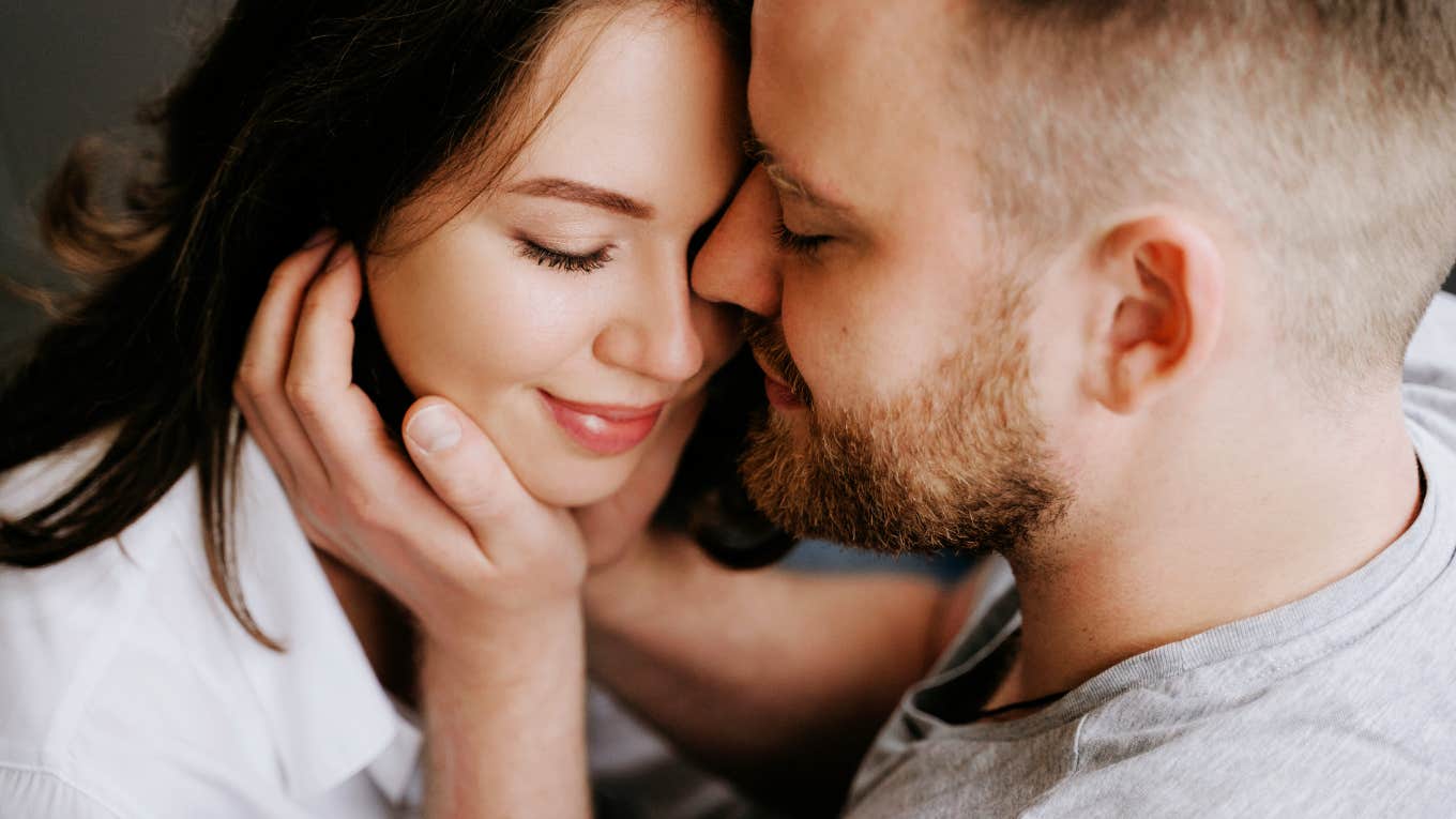 Things Women Need From Their Men Every Single Day Woman embracing connection from her partner.