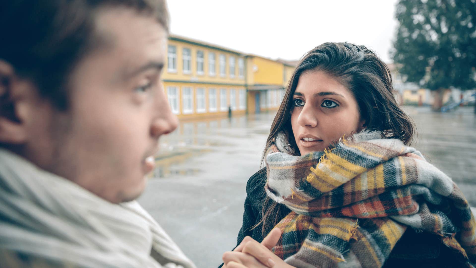 woman apologizing to man on street