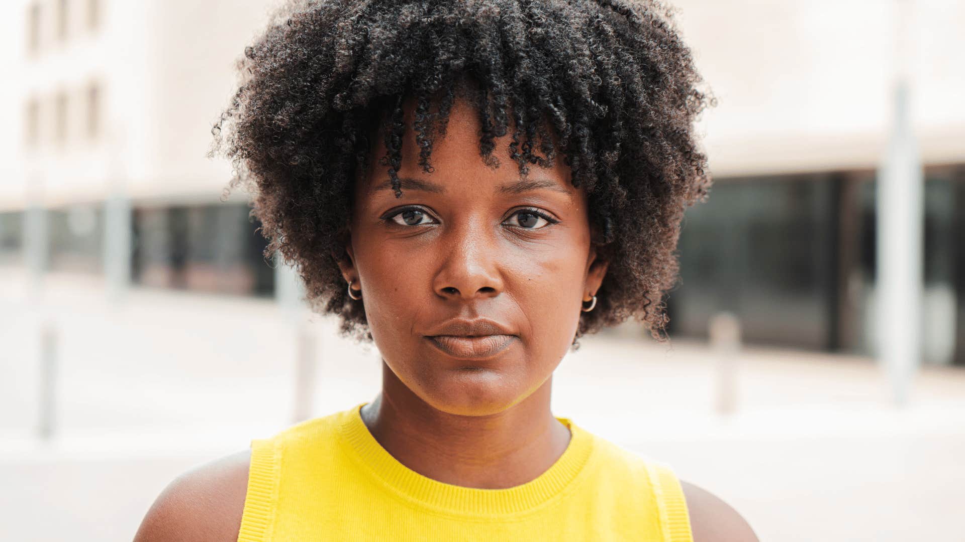 serious woman standing outside getting unsolicited opinions