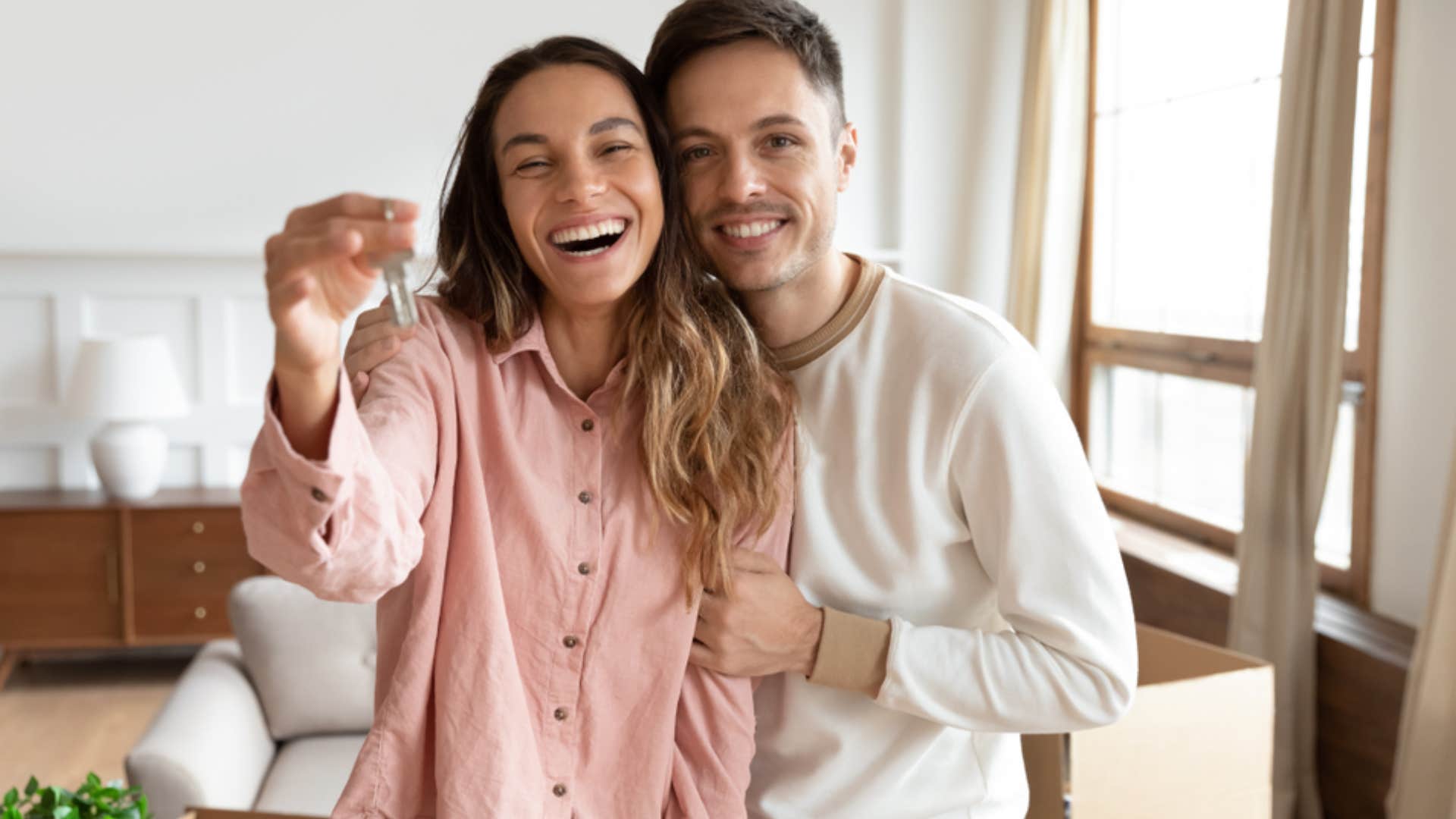 happy couple after buying a home