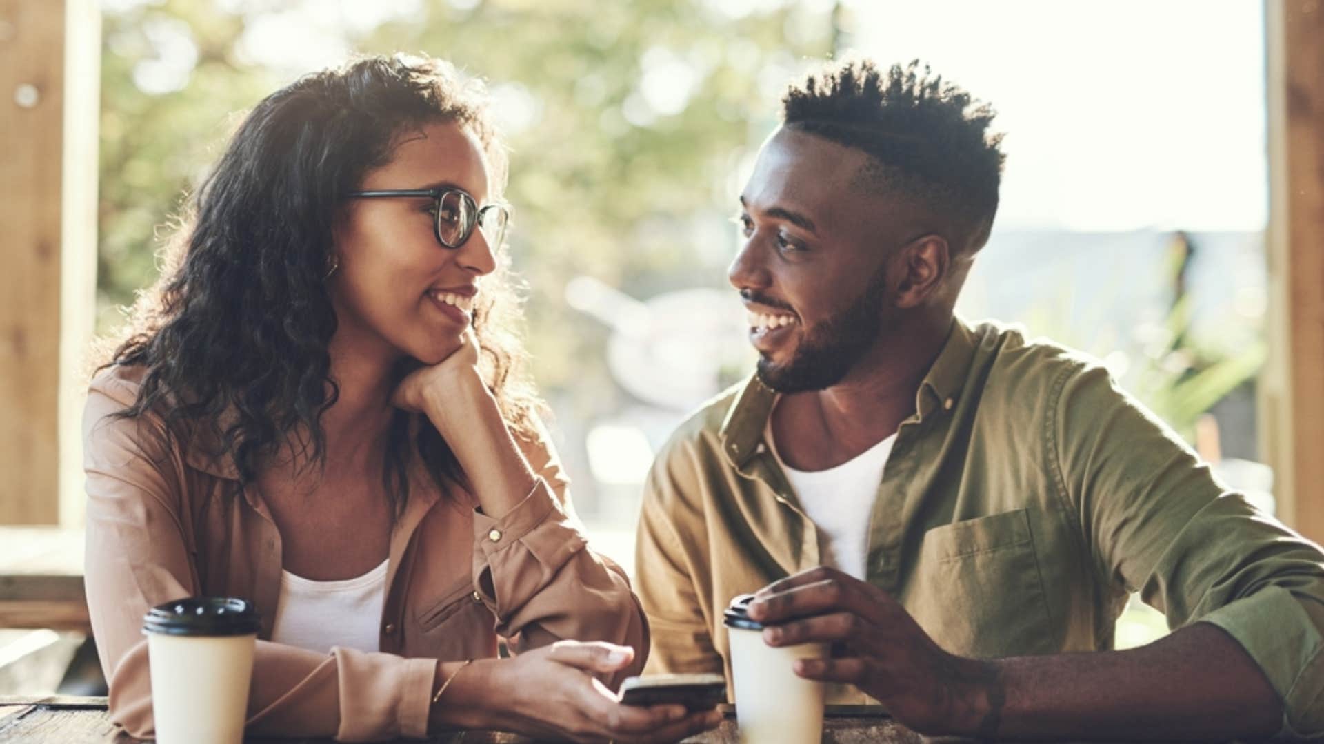 man and woman on a first date over coffee