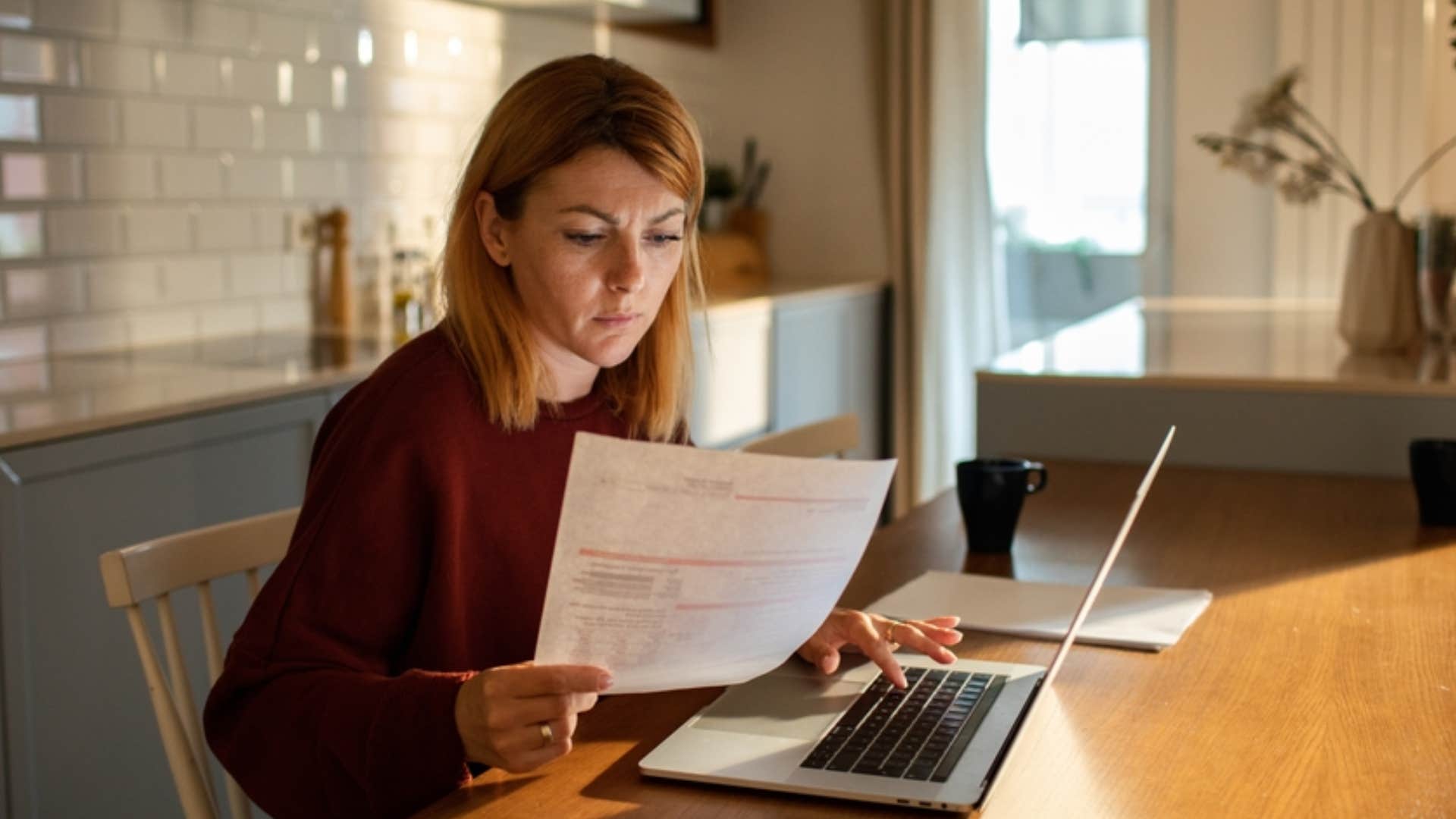 stressed woman trying to pay bill