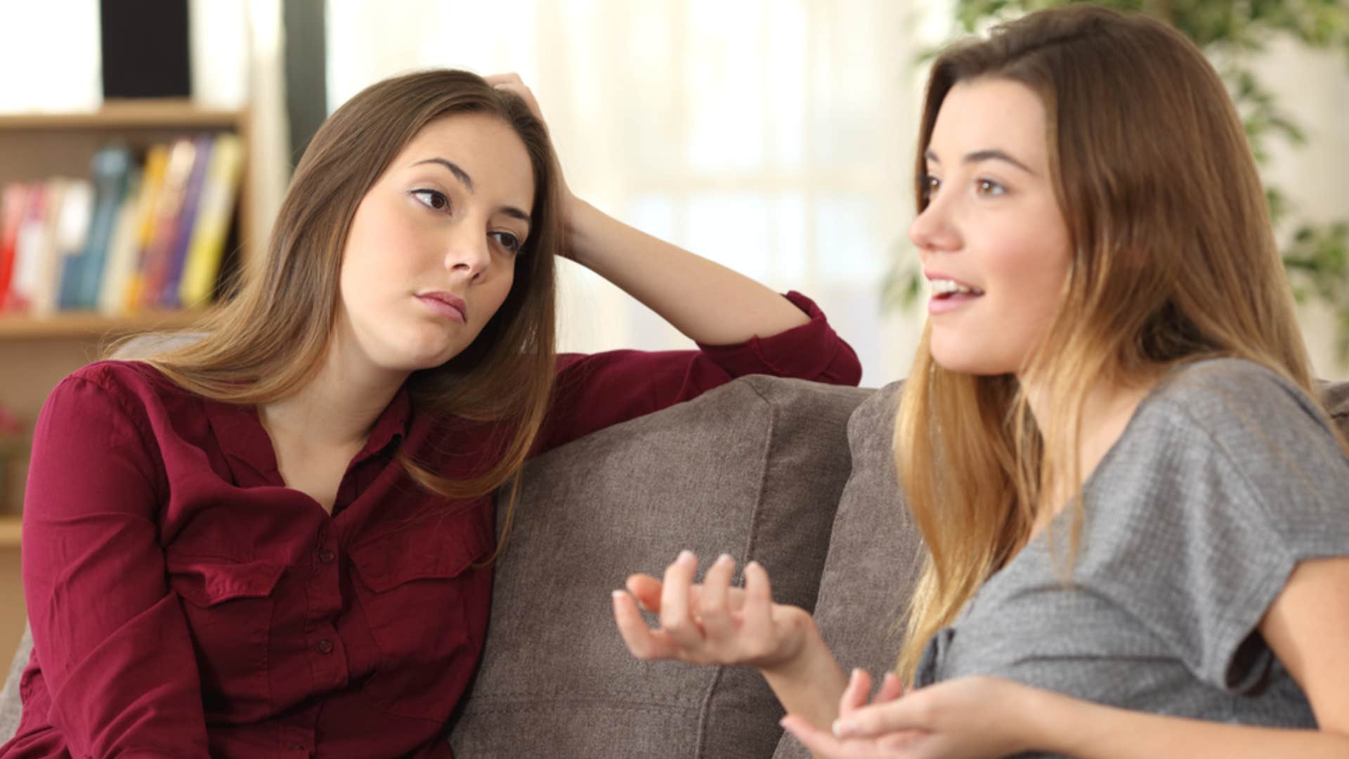 tired woman listening to friend talk